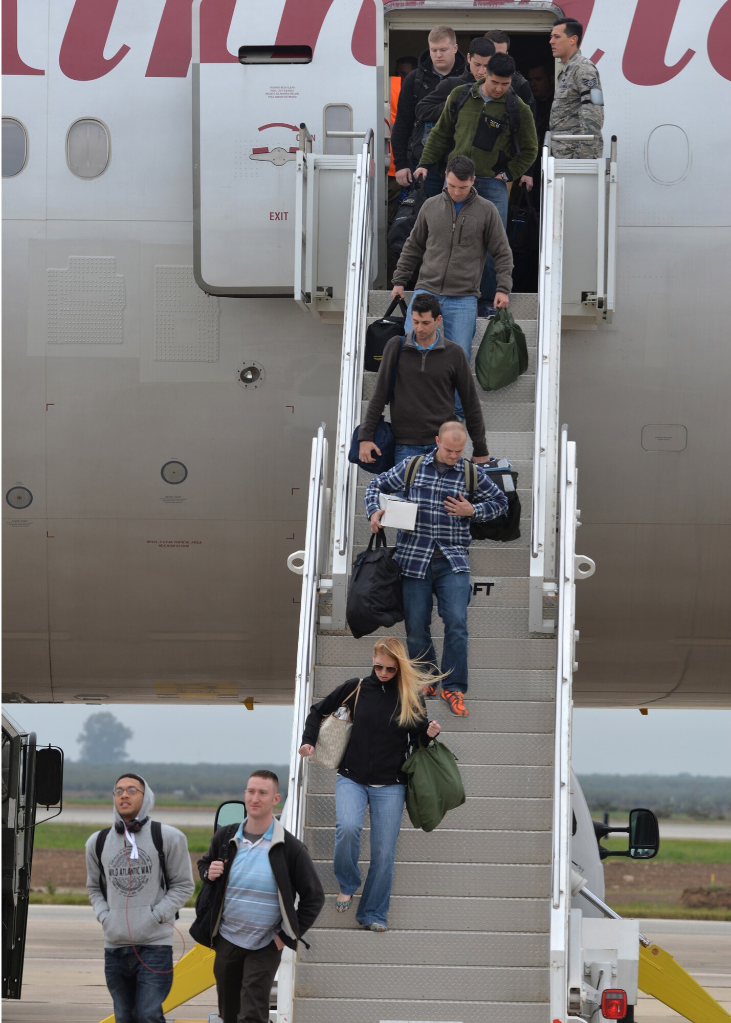 Personnel from Barksdale Air Force Base, La., arrive at Morón Air Base, Spain, Feb. 26, 2016, in preparation for participation in a large-scale NATO military training exercise. These Airmen will support B-52 Stratofortress operations as part of the 2nd Expeditionary Bomb Group during Cold Response 16, this year’s Norewegian-led iteration of the biennial exercise.