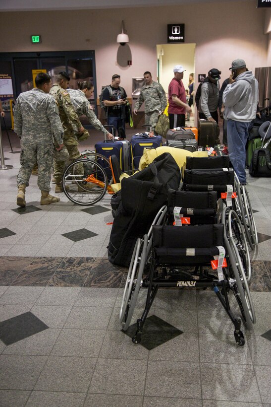 Army active duty and veteran Warrior Trial athletes pick up their equipment at El Paso International Airport, El Paso, Texas, Feb. 26, 2016. More than 100 wounded, ill and injured soldiers and veterans are on Fort Bliss to train and compete in a series of athletic events including archery, cycling, shooting, sitting volleyball, swimming, track, and field, and wheelchair basketball. Army Trails, March 6-10, are conducted by the Department of Defense Warrior Games 2016 Army Team, Approximately 250 athletes, representing teams from the Army, Marine Corps, Navy, Air Force, Special Operations Command and the British Armed Forces will compete in the DoD Warrior Games June 14-22 at the U.S. Military Academy, West Point, N.Y. U.S. Army photo by Spc. Jensen Craig