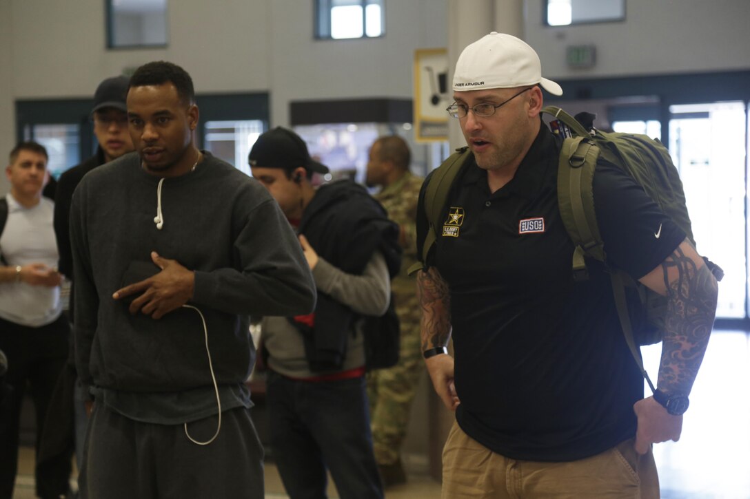 Army active duty and veterans wait to gather luggage at the El Paso International Airport, El Paso, Texas, Feb. 26, 2016. More than 100 wounded, ill and injured soldiers and veterans are on Fort Bliss to train and compete in a series of athletic events including archery, cycling, shooting, sitting volleyball, swimming, track, and field, and wheelchair basketball. Army Trails, March 6-10, are conducted by the Department of Defense Warrior Games 2016 Army Team, Approximately 250 athletes, representing teams from the Army, Marine Corps, Navy, Air Force, Special Operations Command and the British Armed Forces will compete in the DoD Warrior Games June 14-22 at the U.S. Military Academy, West Point, N.Y. U.S. Army photo by Spc. Adasia Ortiz