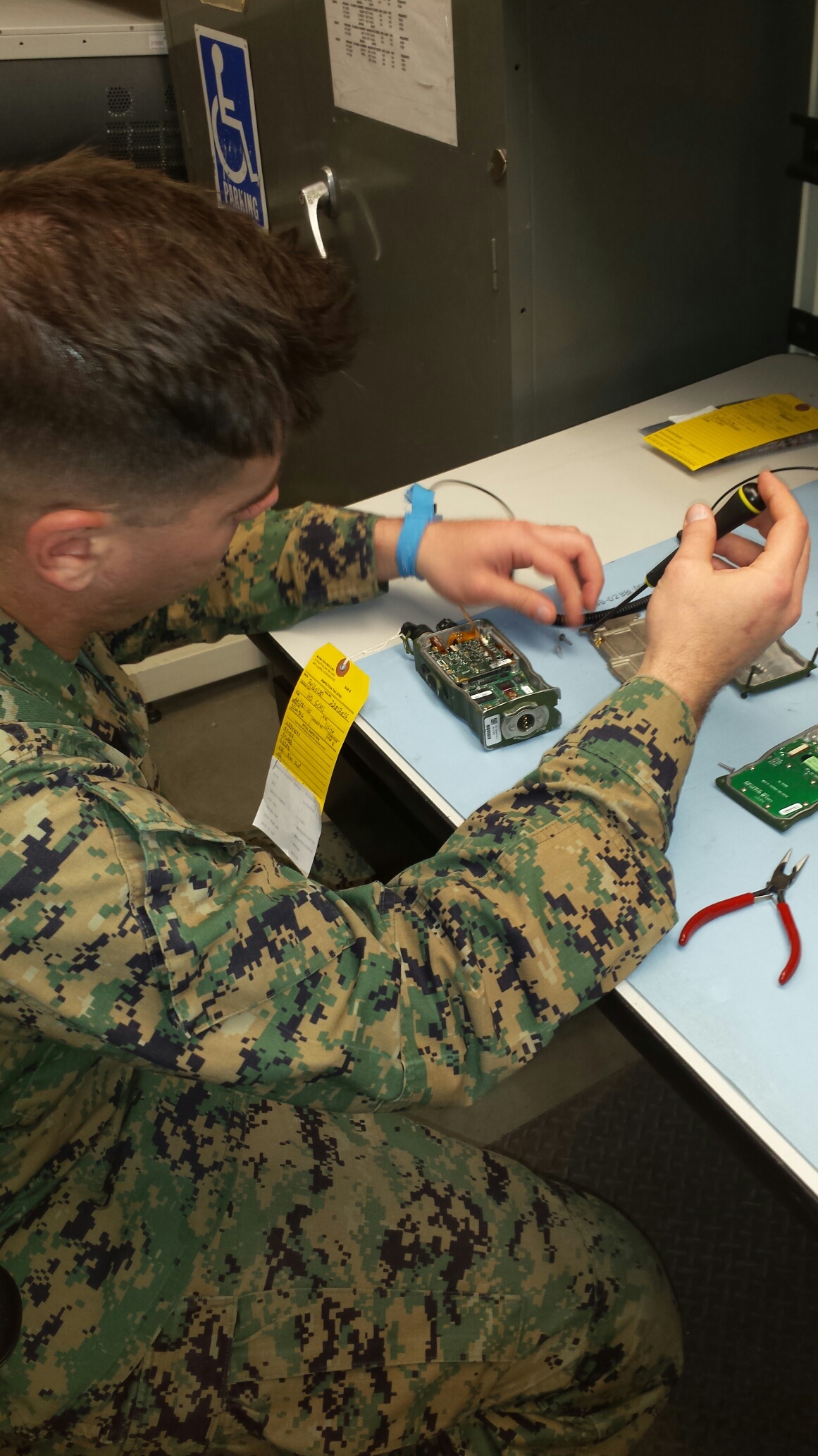 Corporal Ronald D. Wagner opens a radio known as a RT-1916 to replace the broken Power Circuit Card. Cpl Wagner is a seasoned and knowledgeable Marine in the Ground Radio Intermediate Repair Team (GRIRT) apart of the Ground Radio Maintenance Section (GCMS).
