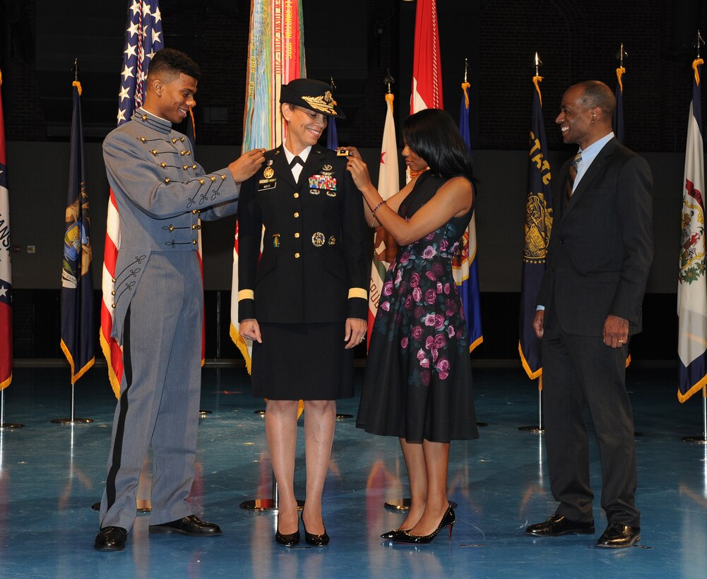 Army Surgeon General Lt. Gen. Nadja Y. West has her three-star shoulderboards pinned on by son, Logan, and daughter, Sydney while her husband Don looks on. West was promoted during a ceremony hosted by Army Chief of Staff Gen. Mark A. Milley on Joint Base Myer-Henderson Hall, Va., Feb. 9, 2016.
