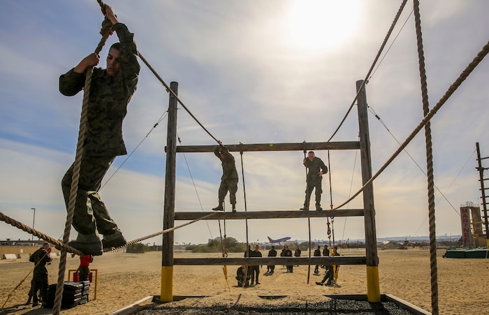 Recruits of Alpha Company, 1st Recruit Training Battalion, tackle an obstacle during Confidence Course II at Marine Corps Recruit Depot San Diego, Feb. 23. Many of the obstacles test the recruits’ confidence and mental strength in overcoming the challenges before them. Annually, more than 17,000 males recruited from the Western Recruiting Region are trained at MCRD San Diego. Alpha Company is scheduled to graduate April 22.
