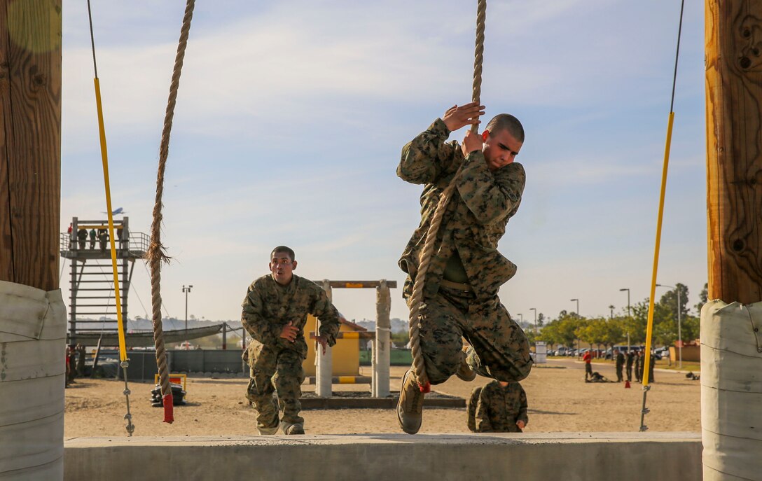 Recruits of Alpha Company, 1st Recruit Training Battalion, leap for a rope during Confidence Course II at Marine Corps Recruit Depot San Diego, Feb. 23. Recruits were instructed to use their momentum to get from one side of the obstacle to the other. Annually, more than 17,000 males recruited from the Western Recruiting Region are trained at MCRD San Diego. Alpha Company is scheduled to graduate April 22.