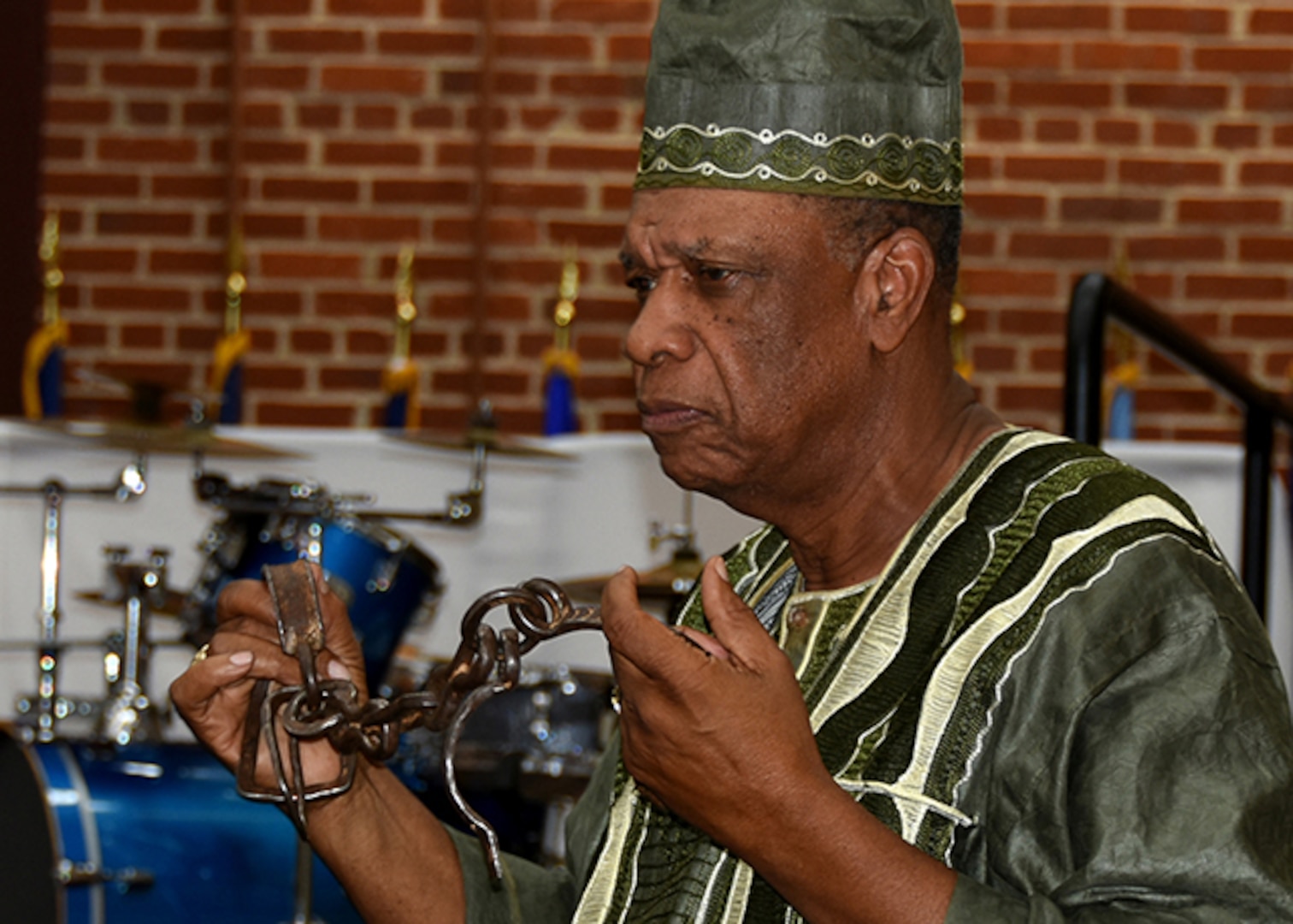 Richard Stewart, Army veteran, Defense Supply Center Richmond, Virginia retiree, and owner and orator of Pocahontas Island Black History Museum, shows slave shackles and chains that were pulled from the Appomattox River.  These devices were used to bind Virginia slaves during that part of our nation’s history.  Stewart served as the keynote speaker during the Black History Month Observance held at DSCR Feb. 25, 2016.  