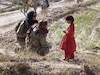 Wearing a black head cover, Chief Warrant Officer 4 Raquel Patrick, Army Ordnance Training Detachment-Fort Gordon division deputy chief and Cultural Support Team-2 member, is shown asking an Afghan child if she was enrolled in school and if not, if she'd like to go, November 2011, in Afghanistan. Many female CST-2 members like Patrick were deployed to Afghanistan and were given the primary duty of engaging the female population of Afghanistan. This is because in the Afghan culture, it is inappropriate for male military members to engage with female Afghans.
BOOKMARK & SHARE