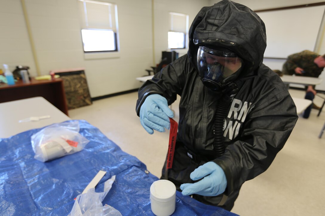 Lance Cpl. Nikolas Raven tests simulated biohazards during a mock training drill at Marine Corps Air Station Cherry Point, N.C., Feb. 19, 2016. Marines with with Marine Wing Headquarters Squadron 2, Marine Aircraft Group 14 and Marine Aircraft Group 28 took part in a three-day long training exercise where Marines honed their skills with their equipment and knowledge of protocol. Marines conducted live radiological training at Marine Corps Outlying Field Atlantic as part of additional training to prepare them for any potential situation that may arise in the future and concluded the exercice with a debrief at MCAS Cherry Point. Raven is a chemical, biological, radiological nuclear defense specialist with MWHS-2. (U.S. Marine Corps photo by Cpl. N.W. Huertas/Released) 