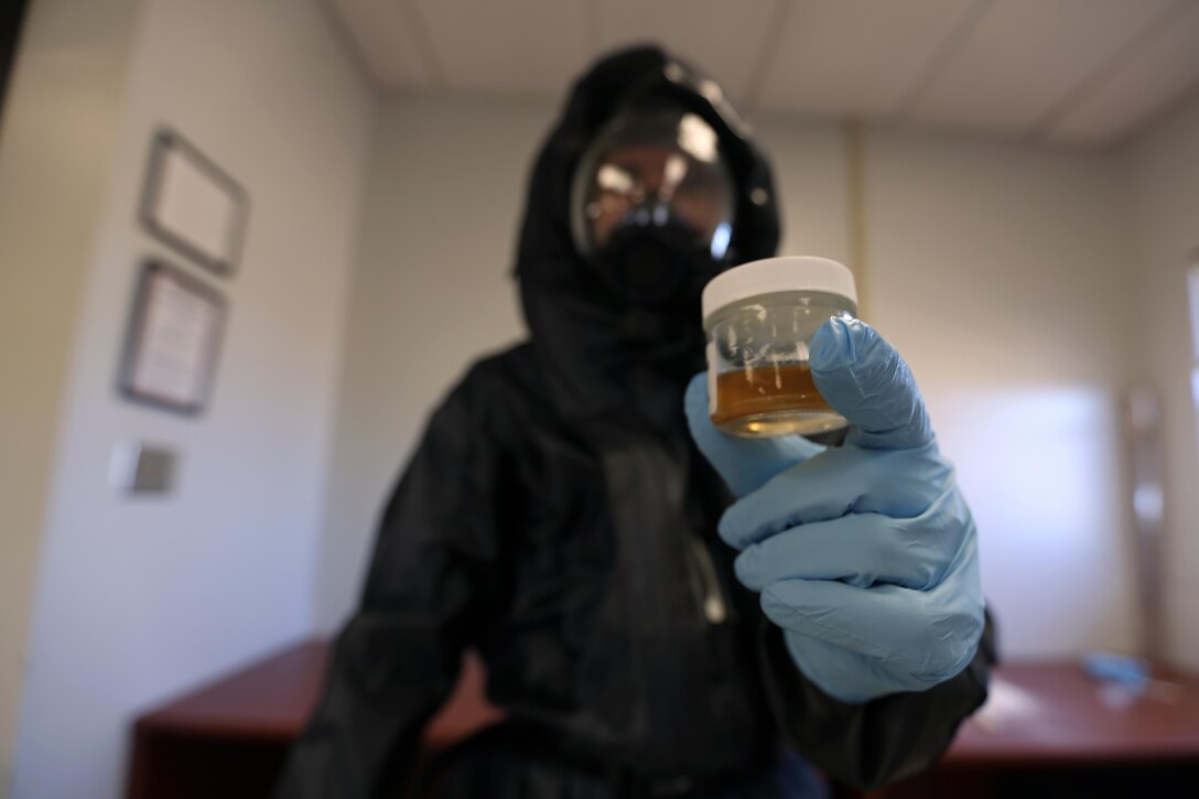 Corporal Jeremy Case tests simulated biohazards during a mock training drill at Marine Corps Air Station Cherry Point, N.C., Feb. 19, 2016. Marines with with Marine Wing Headquarters Squadron 2, Marine Aircraft Group 14 and Marine Aircraft Group 28 took part in a three-day long training exercise where Marines honed their skills with their equipment and knowledge of protocol. Marines conducted live radiological training at Marine Corps Outlying Field Atlantic as part of additional training to prepare them for any potential situation that may arise in the future and concluded the exercice with a debrief at MCAS Cherry Point. Case is a chemical, biological, radiological nuclear defense specialist with MWHS-2. (U.S. Marine Corps photo by Cpl. N.W. Huertas/Released)