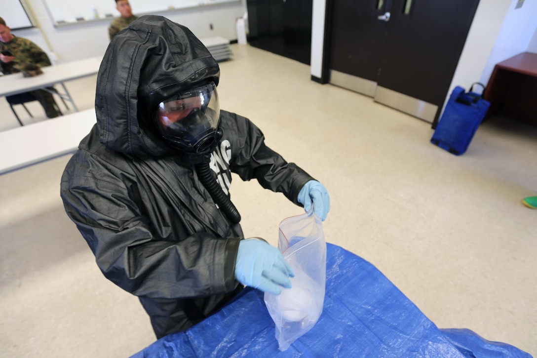 Lance Cpl. Nikolas Raven tests simulated biohazards during a mock training drill at Marine Corps Air Station Cherry Point, N.C., Feb. 19, 2016. Marines with with Marine Wing Headquarters Squadron 2, Marine Aircraft Group 14 and Marine Aircraft Group 28 took part in a three-day long training exercise where Marines honed their skills with their equipment and knowledge of protocol. Marines conducted live radiological training at Marine Corps Outlying Field Atlantic as part of additional training to prepare them for any potential situation that may arise in the future and concluded the exercice with a debrief at MCAS Cherry Point. Raven is a chemical, biological, radiological nuclear defense specialist with MWHS-2. (U.S. Marine Corps photo by Cpl. N.W. Huertas/Released)