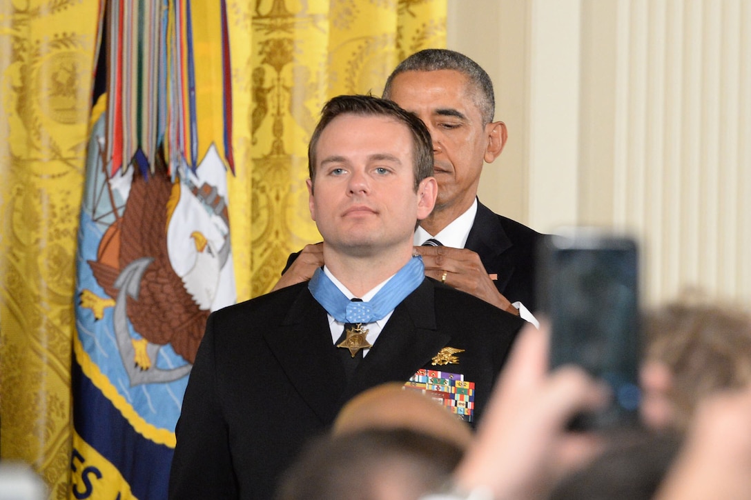 President Barack Obama presents the Medal of Honor to Navy Senior Chief Petty Officer Edward C. Byers Jr. during a ceremony at the White House in Washington, D.C., Feb. 29, 2016. DoD photo by EJ Hersom