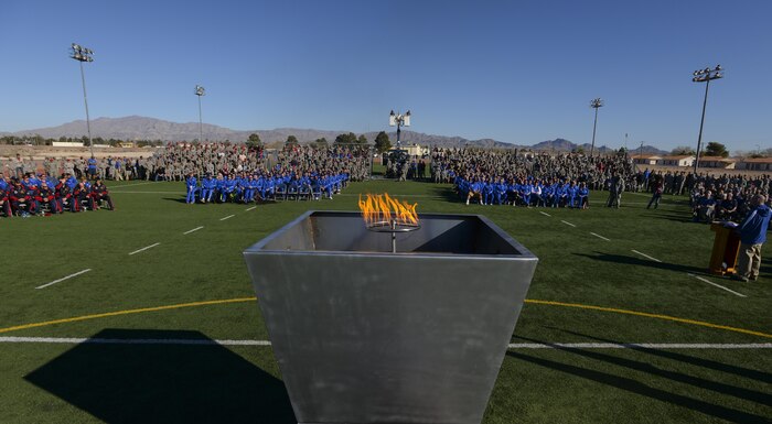 Members of the American team, Australian team, and Airmen stationed at Nellis Air Force Base look on during the opening ceremony of the 2016 Air Force Wounded Warrior Trials, Feb. 26. Service members are participating in adaptive athletic reconditioning for lasting effects on physical and emotional recovery. (U.S. Air Force photo by Airman 1st Class Kevin Tanenbaum)