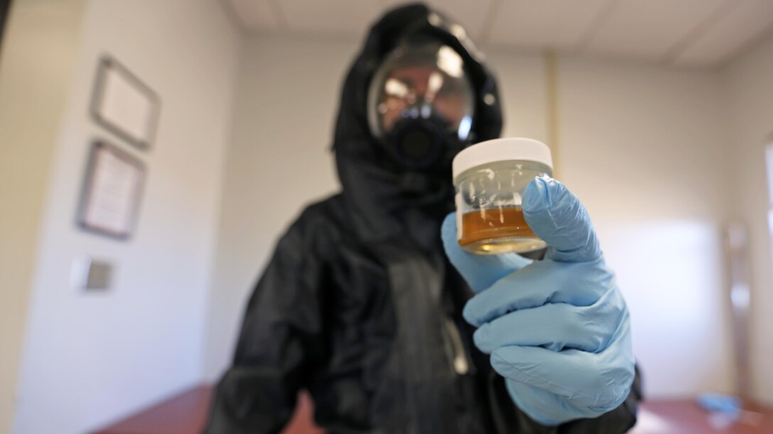 Corporal Jeremy Case tests simulated biohazards during a mock training drill at Marine Corps Air Station Cherry Point, N.C., Feb. 19, 2016. Marines with with Marine Wing Headquarters Squadron 2, Marine Aircraft Group 14 and Marine Aircraft Group 28 took part in a three-day long training exercise where Marines honed their skills with their equipment and knowledge of protocol. Marines conducted live radiological training at Marine Corps Outlying Field Atlantic as part of additional training to prepare them for any potential situation that may arise in the future and concluded the exercise with a debrief at MCAS Cherry Point. Case is a chemical, biological, radiological nuclear defense specialist with MWHS-2.