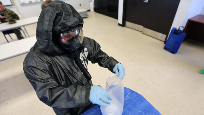 Lance Cpl. Nikolas Raven tests simulated biohazards during a mock training drill at Marine Corps Air Station Cherry Point, N.C., Feb. 19, 2016. Marines with with Marine Wing Headquarters Squadron 2, Marine Aircraft Group 14 and Marine Aircraft Group 28 took part in a three-day long training exercise where Marines honed their skills with their equipment and knowledge of protocol. Marines conducted live radiological training at Marine Corps Outlying Field Atlantic as part of additional training to prepare them for any potential situation that may arise in the future and concluded the exercice with a debrief at MCAS Cherry Point. Raven is a chemical, biological, radiological nuclear defense specialist with MWHS-2.