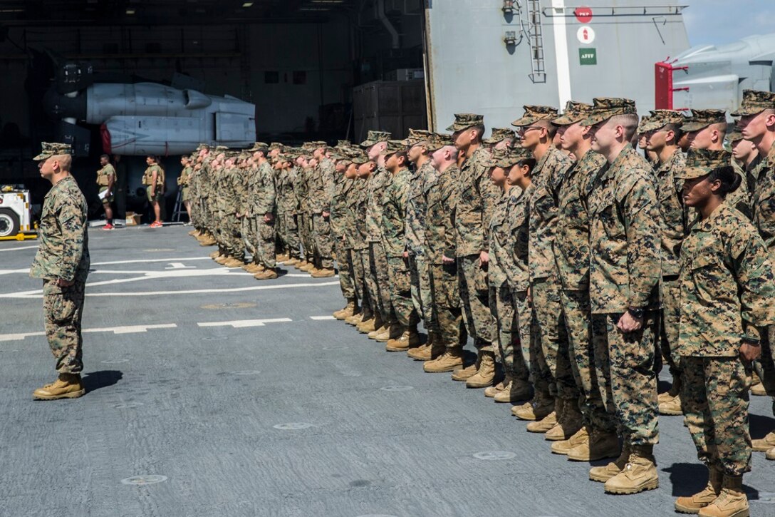 U.S. Marines and Sailors with the 13th Marine Expeditionary Unit aboard the USS New Orleans render honors to the Pearl Harbor memorial, Feb. 23, 2016. More than 4,500 Sailors and Marines from the Boxer Amphibious Ready Group, 13th Marine Expeditionary Unit team are currently transiting the Pacific Ocean toward the U.S. 7th Fleet area of operations during a scheduled deployment. (U.S. Marine Corps photo by Lance Cpl. Alvin Pujols/RELEASED)