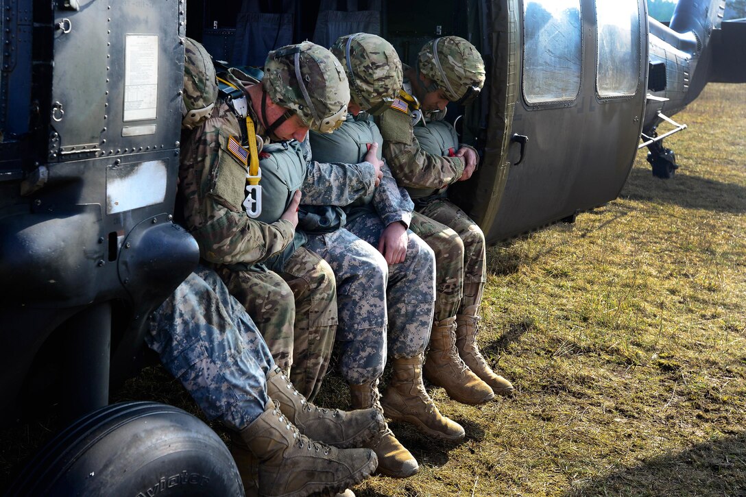 Paratroopers rehearse jumping from a UH-60 Black Hawk helicopter at the Grafenwoehr Training Area, Germany, Feb. 18, 2016. The paratroopers are assigned to 4th Battalion, 319th Airborne Field Artillery Regiment, 173rd Airborne Brigade. U.S. Army photo by Pfc. Emily Houdershieldt