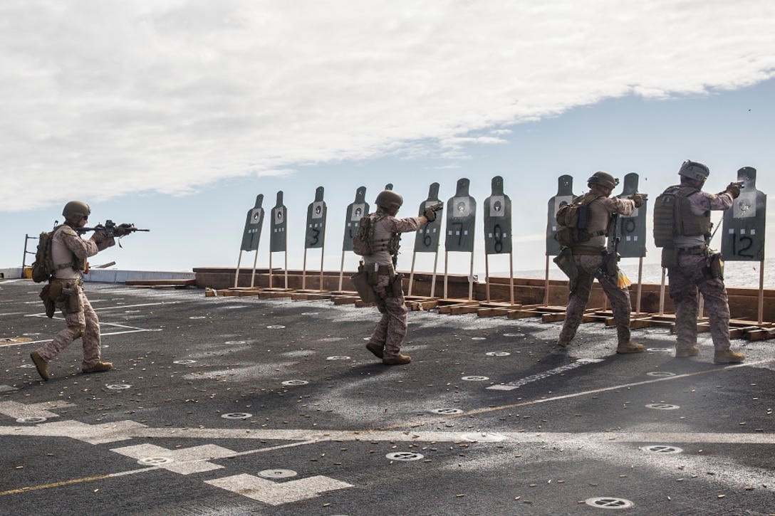 U.S. Marines and Sailors with the 13th Marine Expeditionary Unit execute close quarters firing drills aboard the USS New Orleans, Pacific Ocean, Feb. 26, 2016. Close quarters drills prepare the service members for missions involving close quarters combat. More than 4,500 Sailors and Marines from the Boxer Amphibious Ready Group, 13th Marine Expeditionary Unit team are currently transiting the Pacific Ocean toward the U.S. 7th Fleet area of operations during a scheduled deployment. (U.S. Marine Corps photo by Lance Cpl. Alvin Pujols/RELEASED)