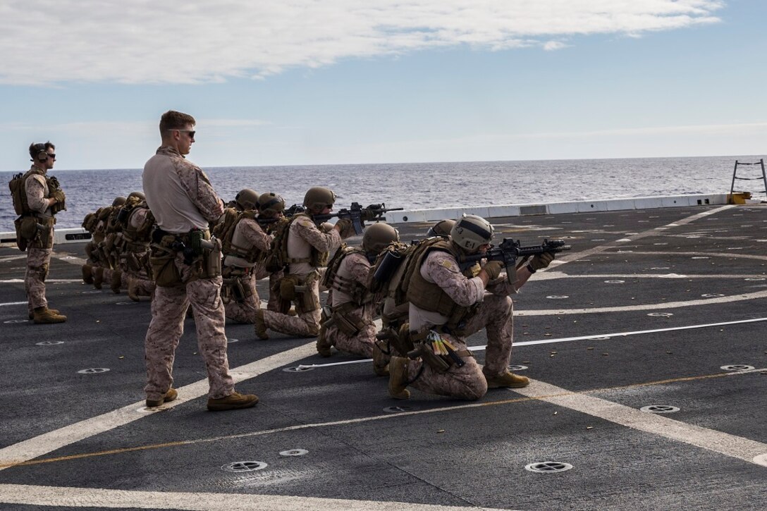 U.S. Marines and Sailors with the 13th Marine Expeditionary Unit coordinate a simulated assault on targets aboard the USS New Orleans, at sea, Feb. 26, 2016. More than 4,500 Sailors and Marines from the Boxer Amphibious Ready Group, 13th Marine Expeditionary Unit team are currently transiting the Pacific Ocean toward the U.S. 7th Fleet area of operations during a scheduled deployment. (U.S. Marine Corps photo by Lance Cpl. Alvin Pujols/RELEASED)