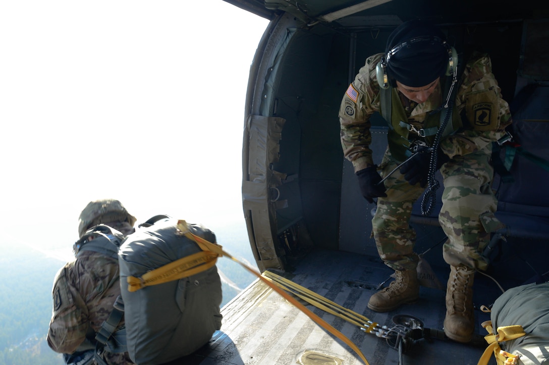 A paratrooper jumps from a UH-60 Black Hawk during an airborne exercise over Grafenwoehr Training Area, Germany, Feb. 18, 2016. U.S. Army photo by Pfc. Emily Houdershieldt