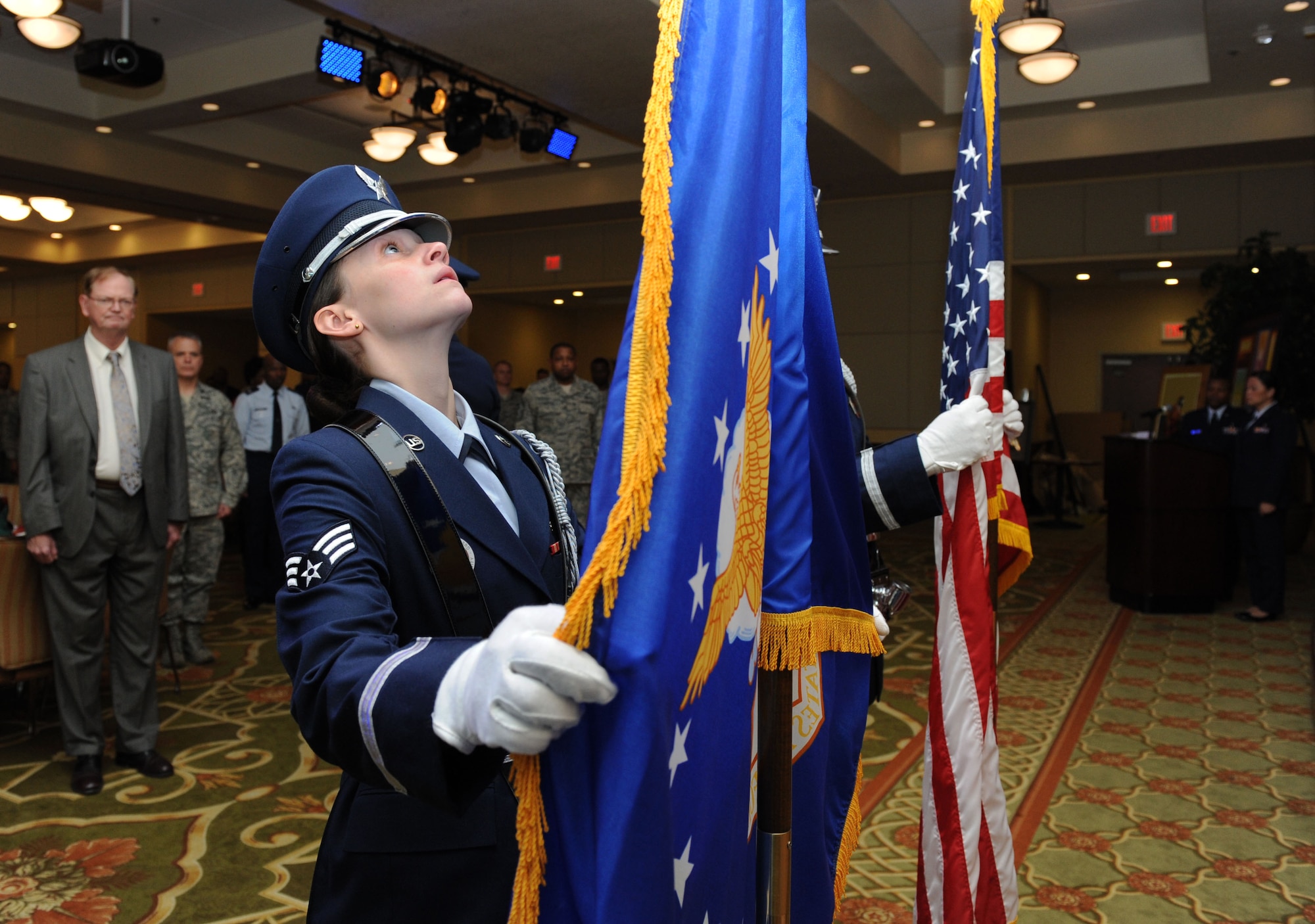 Senior Airman Elle Batdorff, Keesler Honor Guardsman, posts the colors during the African American Heritage Committee's Black History Month luncheon at the Bay Breeze Event Center Feb. 25, 2016, Keesler Air Force Base, Miss. The theme for the event was “Hallowed Grounds: Sites of African American Memories.” (U.S. Air Force photo by Kemberly Groue)