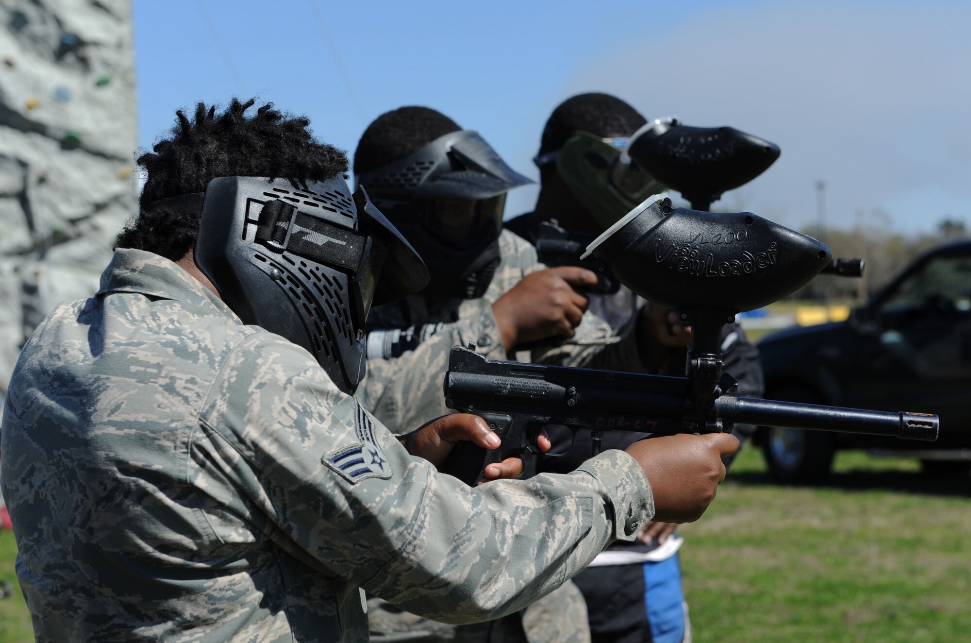 Senior Airmen Quianna Cue, 81st Diagnostic and Therapeutics Squadron histopathology technician, and Aaron Calhoun, 403rd Maintenance Squadron hydraulic technician, fire paint balls at a target during Dragon Fest, Feb. 26, 2016, Keesler Air Force Base, Miss. Dragon Fest is an organization built to help Airmen grow, mentor and network through shared interests by providing more than 40 groups and private organizations. (U.S. Air Force photo by Kemberly Groue)