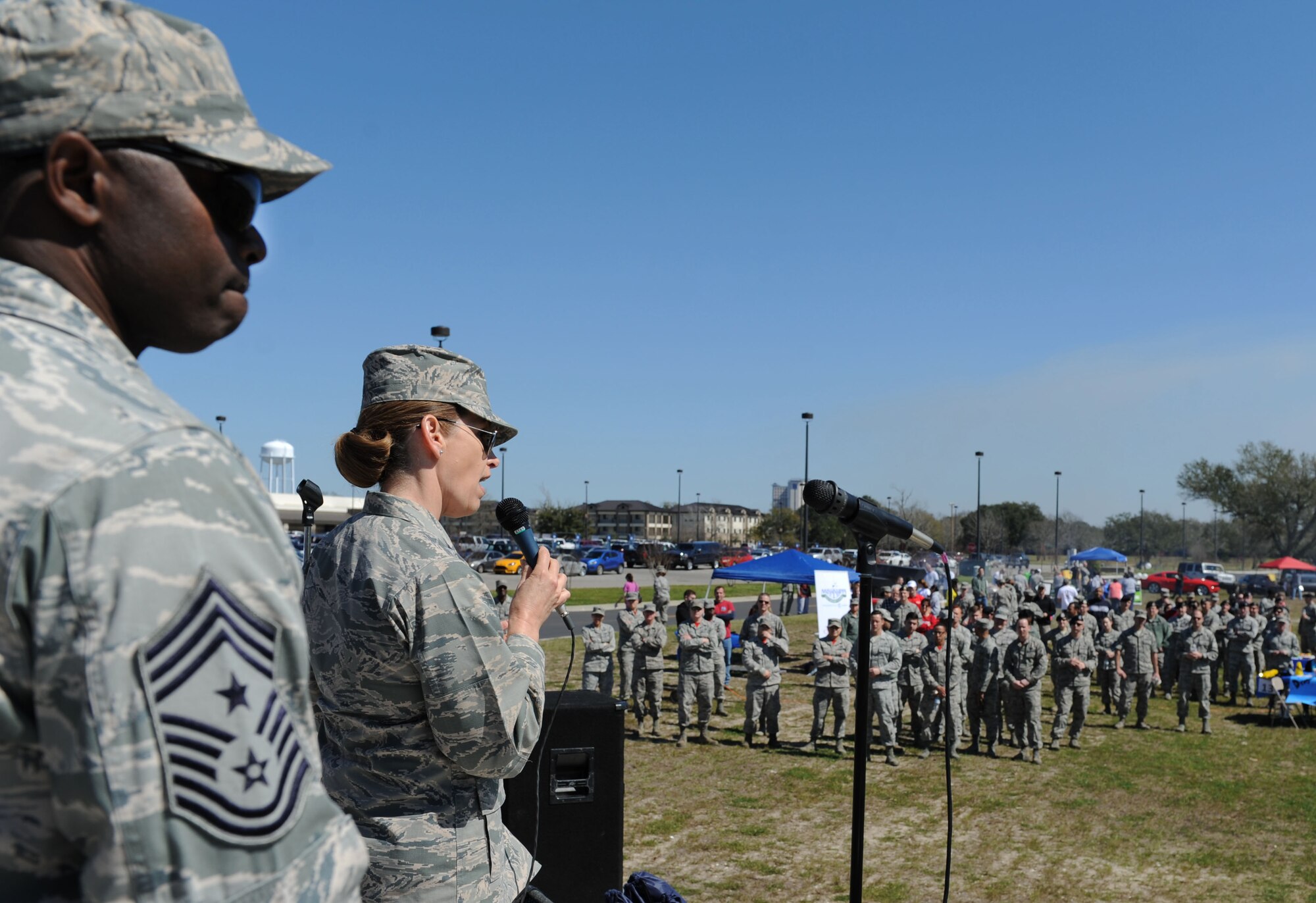 Col. Michele Edmondson, 81st Training Wing commander, delivers remarks to Keesler personnel during Dragon Fest, Feb. 26, 2016, Keesler Air Force Base, Miss. Dragon Fest is an organization built to help Airmen grow, mentor and network through shared interests by providing more than 40 groups and private organizations to showcase what they offer. (U.S. Air Force photo by Kemberly Groue)