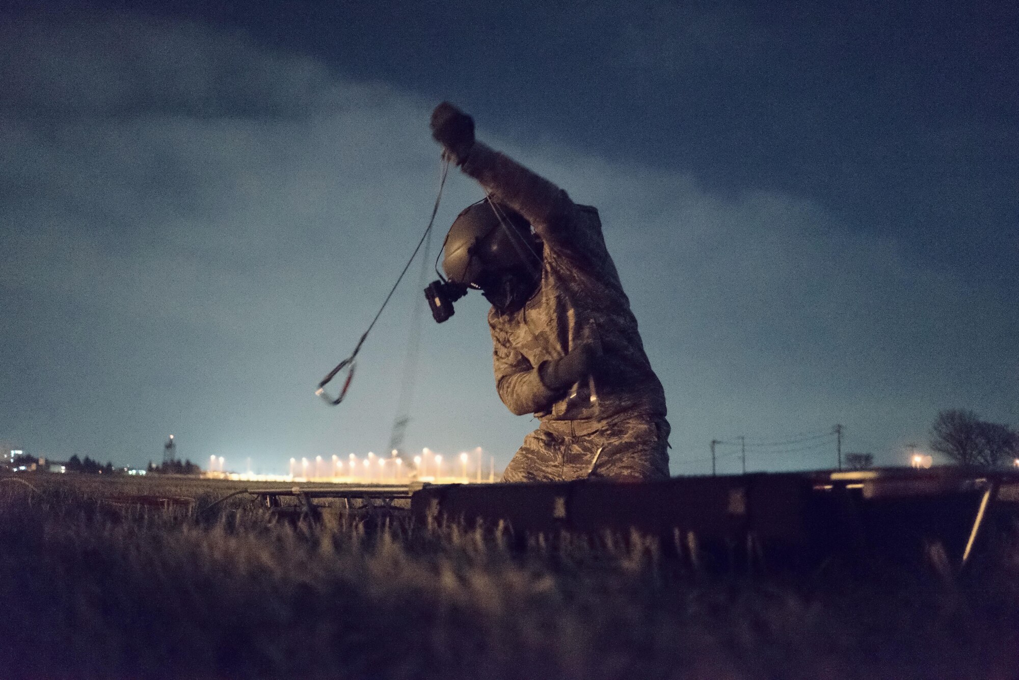 Tech. Sgt. Michael Wright, 459th Airlift Squadron UH-1N Huey flight engineer, prepares stokes litter for hoisting at Yokota Air Base, Japan, Feb. 23, 2016. The 459th AS recently improved their search and rescue capabilities by outfitting two UH-1N Hueys with new rescue hoists. Previously, without the hoist, conducting rescues in small, tight areas wasn’t feasible. Now, 459th AS aircrew can conduct any type of search and rescue scenario throughout the Kanto Plains. (U.S. Air Force photo by Airman 1st Class Delano Scott/Released)