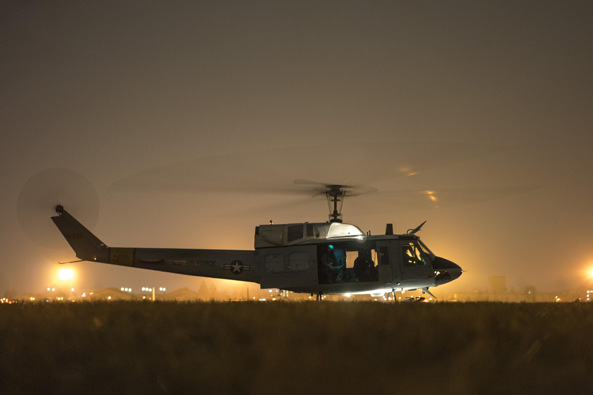 A 459th Airlift Squadron UH-1N Huey prepares for flight at Yokota Air Base, Japan, Feb. 23, 2016. The 459th AS recently improved their search and rescue capabilities by outfitting two Hueys with new rescue hoists. (U.S. Air Force photo by Airman 1st Class Delano Scott/Released)