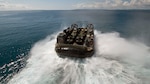 OKINAWA, Japan (Feb. 28, 2016) - Landing craft air cushion (LCAC) 47 disembarks from the well deck of the forward-deployed amphibious assault ship USS Bonhomme Richard (LHD 6) to return Marines and their equipment ashore at White Beach Naval Facility. Bonhomme Richard is the lead ship of the Bonhomme Richard Amphibious Ready Group and is wrapping up a certification exercise (CERTEX) with the embarked 31st Marine Expeditionary Unit. 