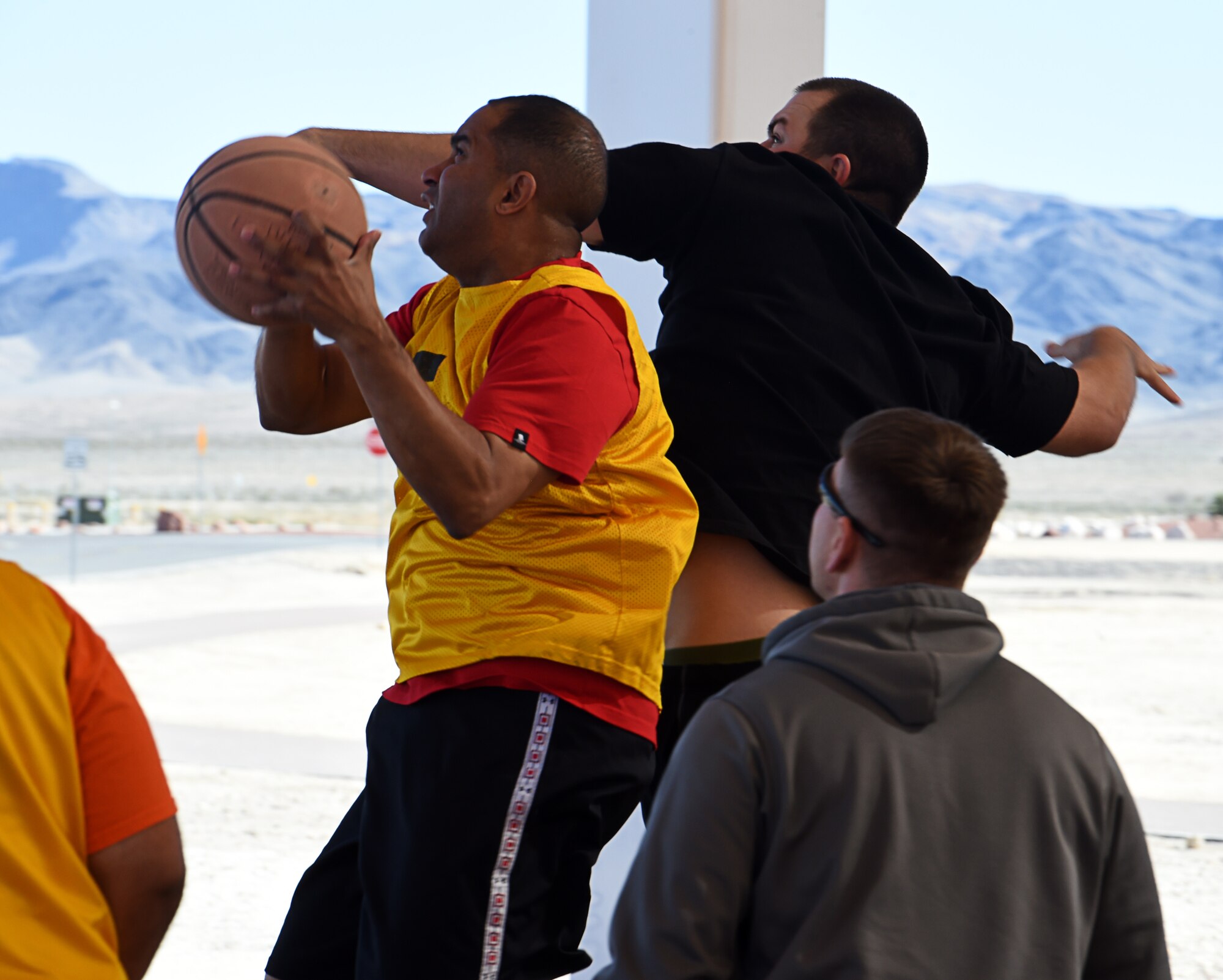 Chief Master Sgt. John, 432nd Maintenance Group chief enlisted manager drives to the basket during a three-on-three basketball tournament Feb. 26, 2016, at Creech Air Force Base, Nevada. This tournament is used as a tool to build morale and amongst the men and women of Creech AFB. (U.S. Air Force photo Senior Airman Adarius Petty/Released)