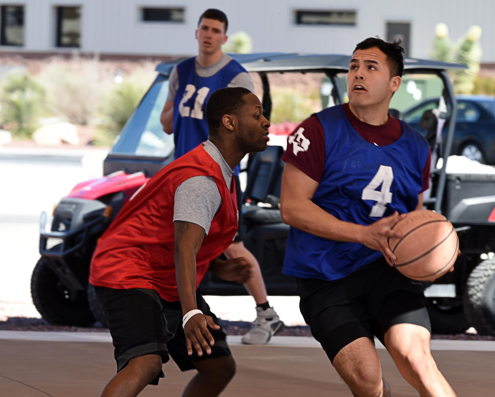 Airmen compete in a three-on-three basketball tournament Feb. 26, 2016, at Creech Air Force Base, Nevada. The 799th Air Base Squadron communications flight defeated seven other teams to be crowned the 2016 champions of the tournament. (U.S. Air Force photo by Senior Airman Adarius Petty/Released)