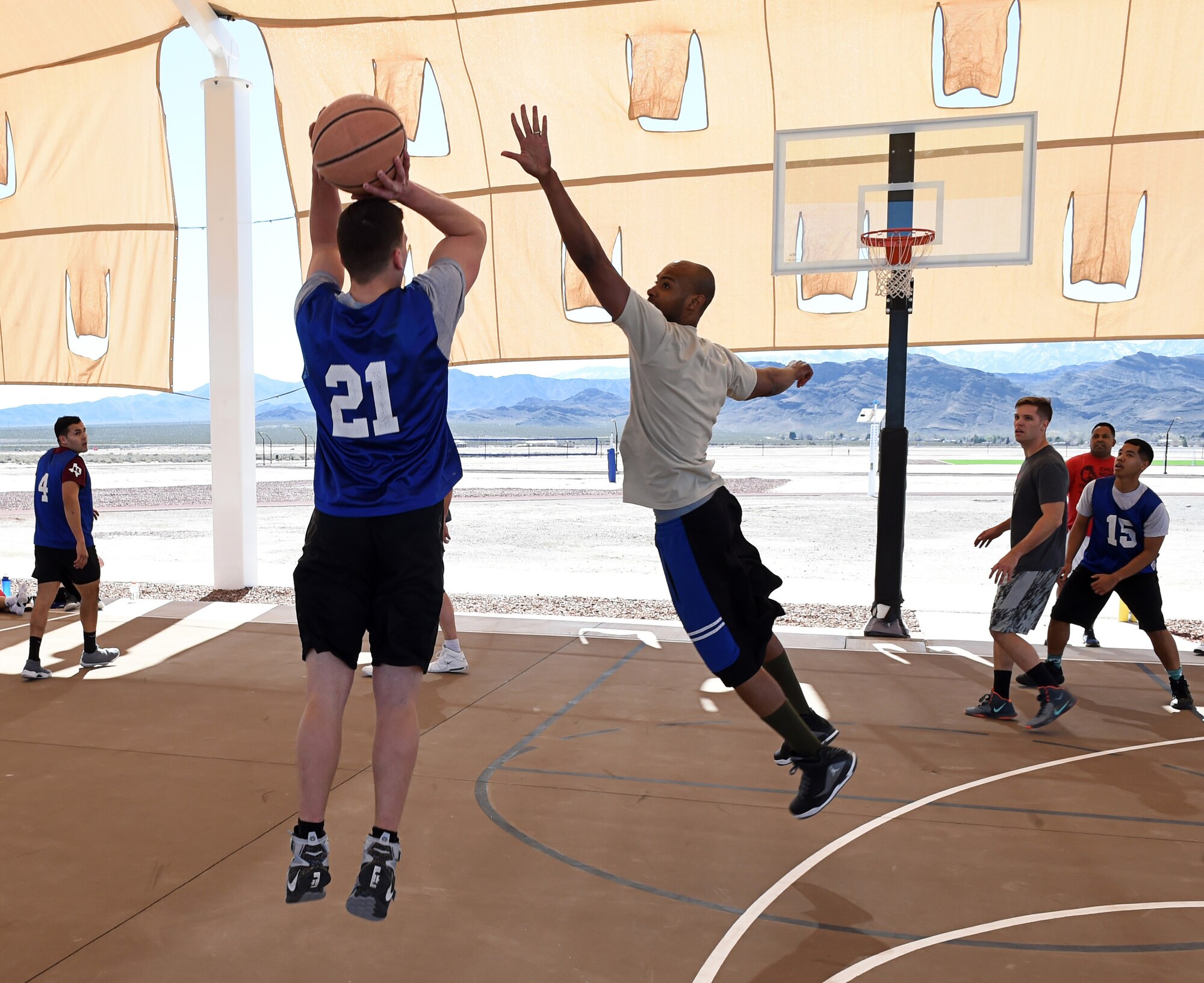 Airmen compete in a three-on-three basketball tournament Feb. 26, 2016, at Creech Air Force Base, Nevada. A team from the 799th Air Base Squadron communication flight won the tournament. (U.S. Air Force photo by Senior Airman Adarius Petty/Released)