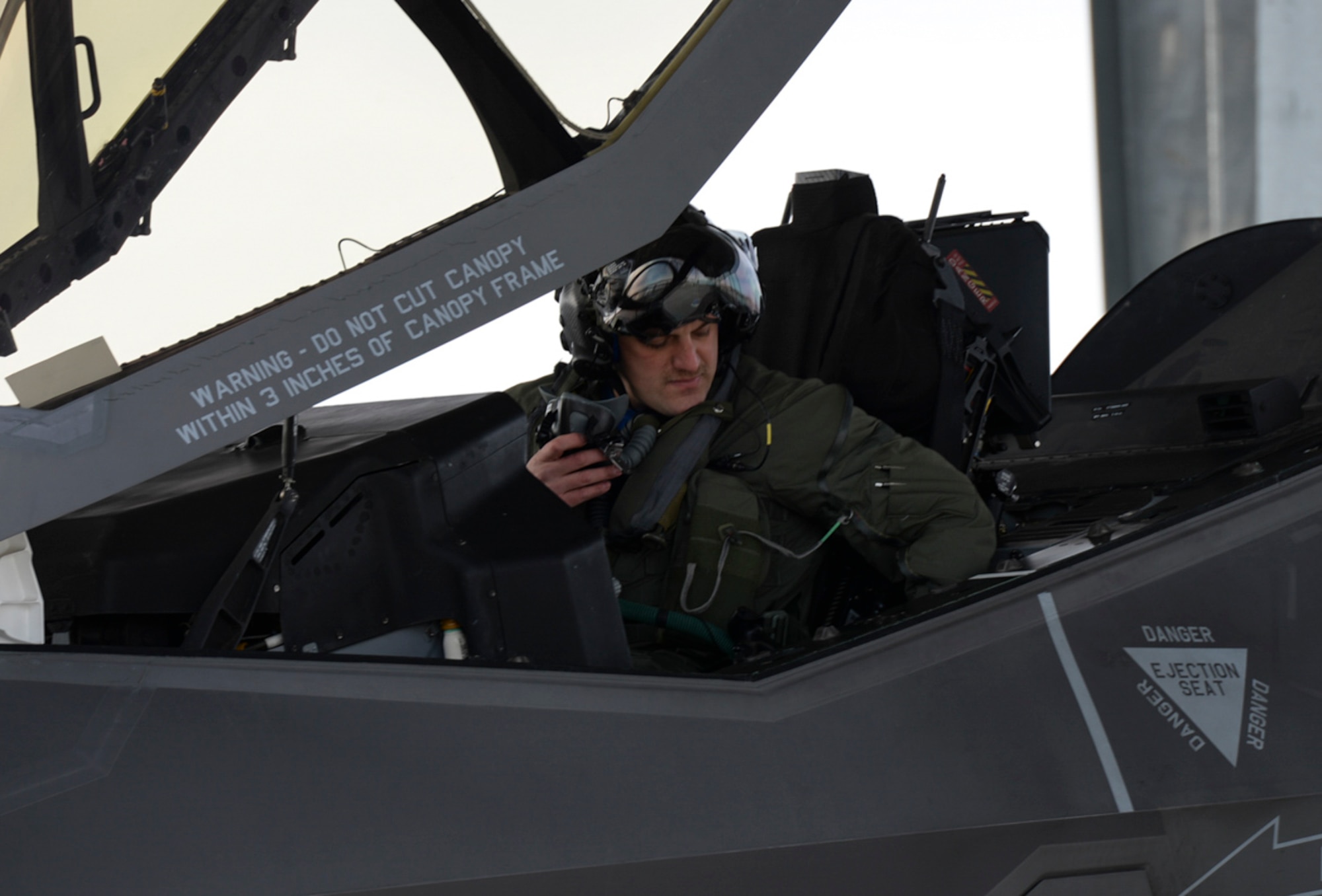 Maj. Ethan Sabin, 31st Test and Evaluation Squadron assistant director of operations, settles into the cockpit of an F-35A at Mountain Home Air Force Base, Idaho, Feb. 12, 2016. Sabin is assigned to the 31st TES from Edwards AFB, Calif., which is part of the 53rd Wing headquartered at Eglin AFB, Fla. (U.S. Air Force photo by Airman 1st Class Jessica H. Evans/RELEASED)