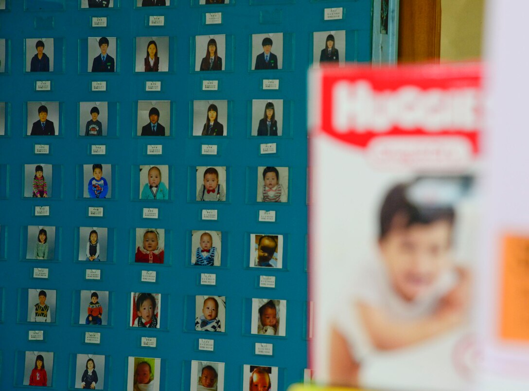 A wall of children’s images is posted in Myung-Jin Orphanage in Seoul, Republic of Korea, Feb. 19, 2016. The wall contains photos of all of the children who live at the orphanage which ranges from newborn to college age. (U.S. Air Force photo by Senior Airman Kristin High/Released)