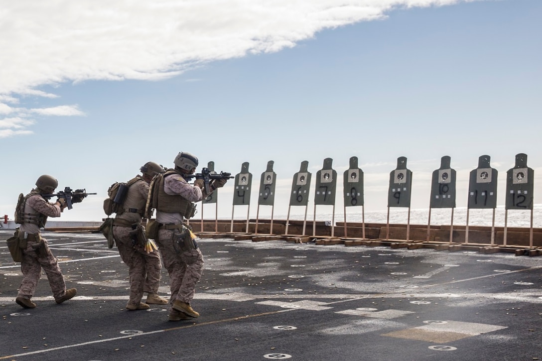 U.S. Marines and Sailors with the 13th Marine Expeditionary Unit execute a live-fire drill side-by-side aboard the USS New Orleans, at sea, Feb. 26, 2015. Practicing side-by-side helps improve the service member's ability to execute missions together in real-life scenarios. More than 4,500 Sailors and Marines from the Boxer Amphibious Ready Group, 13th Marine Expeditionary Unit team are currently transiting the Pacific Ocean toward the U.S. 7th Fleet area of operations during a scheduled deployment.
