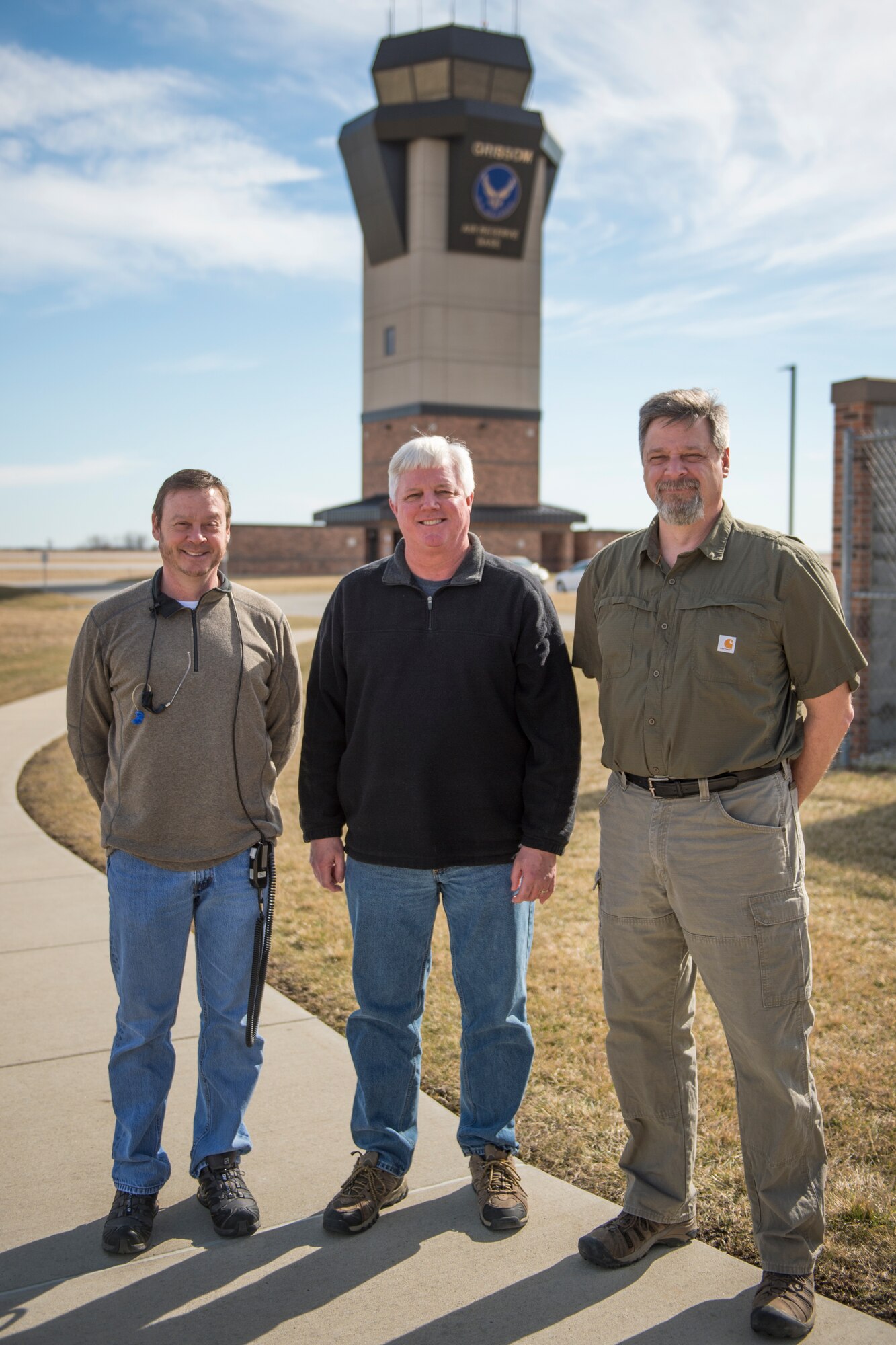 From left to right, Kevin Ware, 434th Operations Support Squadron air traffic control watch supervisor, Robert Moore, 434th OSS airfield operations manager and Paul Colburn, 434th OSS air traffic controller, pose for a photo in front of Grissom’s ATC tower Feb. 29, 2016. The 434th Operations Support Squadron air traffic control section carried on a tradition of excellence as they closed out 2015 with three Air Force Reserve Command Awards. (U.S. Air Force photo/Tech. Sgt. Benjamin Mota) 