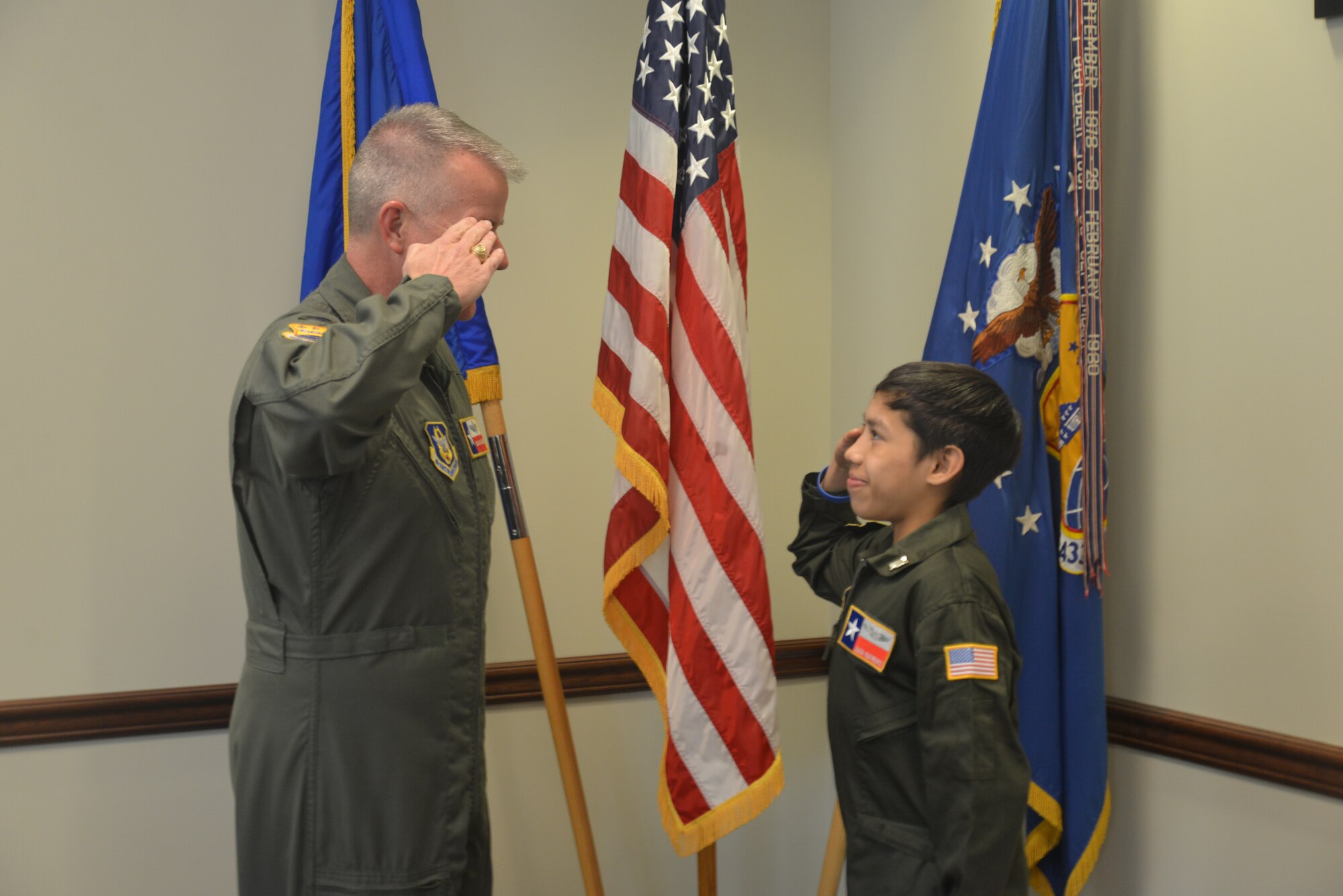 Col. David A. Scott swears in 15-year-old Zach Gutierrez as a Honorary Pilot for a Day Feb. 28, 2016, at the 433rd Airlift Wing, Joint Base San Antonio, Texas. (U.S. Air Force photo by Minnie Jones /Released)