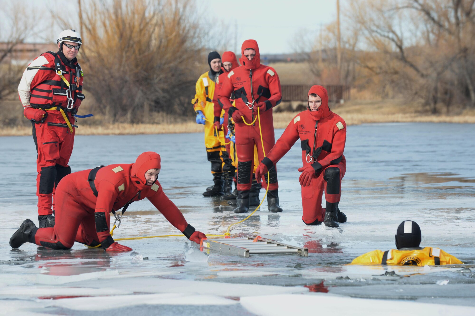 Airmen from the 28th Civil Engineer Squadron Fire Department participate in ice rescue training at Ellsworth Air Force Base, S.D., Feb. 17, 2016. Airmen took part in both classroom instruction and hands-on training to ensure safety and a basic understanding of rescue techniques. (U.S. Air Force photo by Senior Airman Rebecca Imwalle/Released)