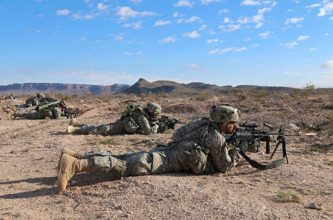 Soldiers from 3rd Battalion, 7th Infantry Regiment, 2nd Infantry Brigade Combat Team, 3rd Infantry Division, lay in the prone position while pulling security during their company live-fire exercise at McGregor Range, N.M., Jan. 26, 2016. (U.S. Army Photo by Spc. Von Marie Donato/Released)