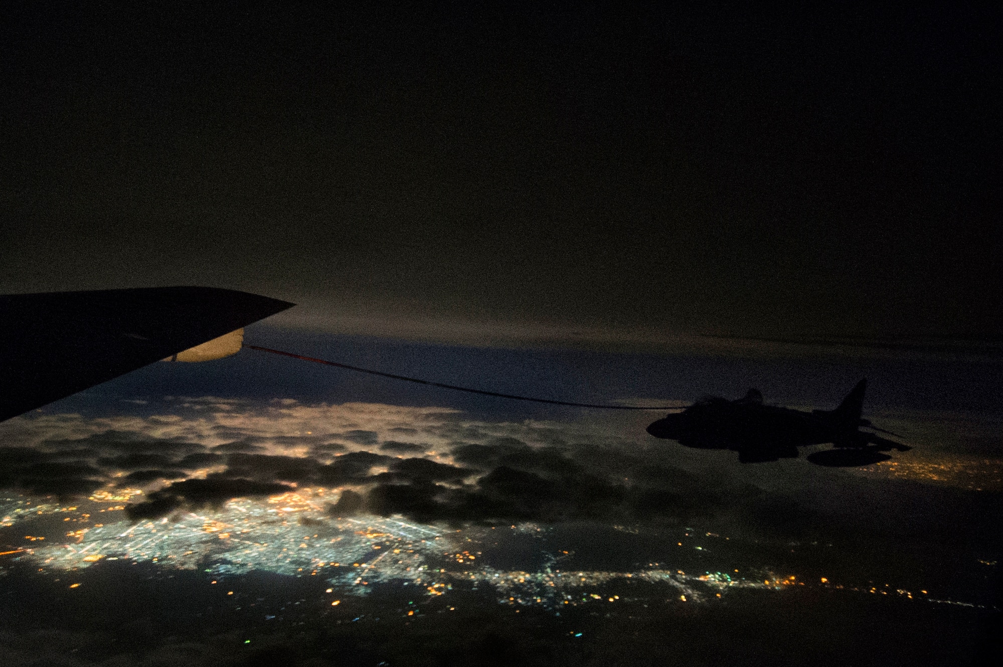 A U.S. Air Force KC-135 Stratotanker assigned to the 340th Expeditionary Air Refueling Squadron refuels a U.S. Marine Corps AV-8B Harrier II over Iraq in support of Operation Inherent Resolve, Dec. 31, 2015.  (U.S. Air Force photo by Tech. Sgt. Nathan Lipscomb)
