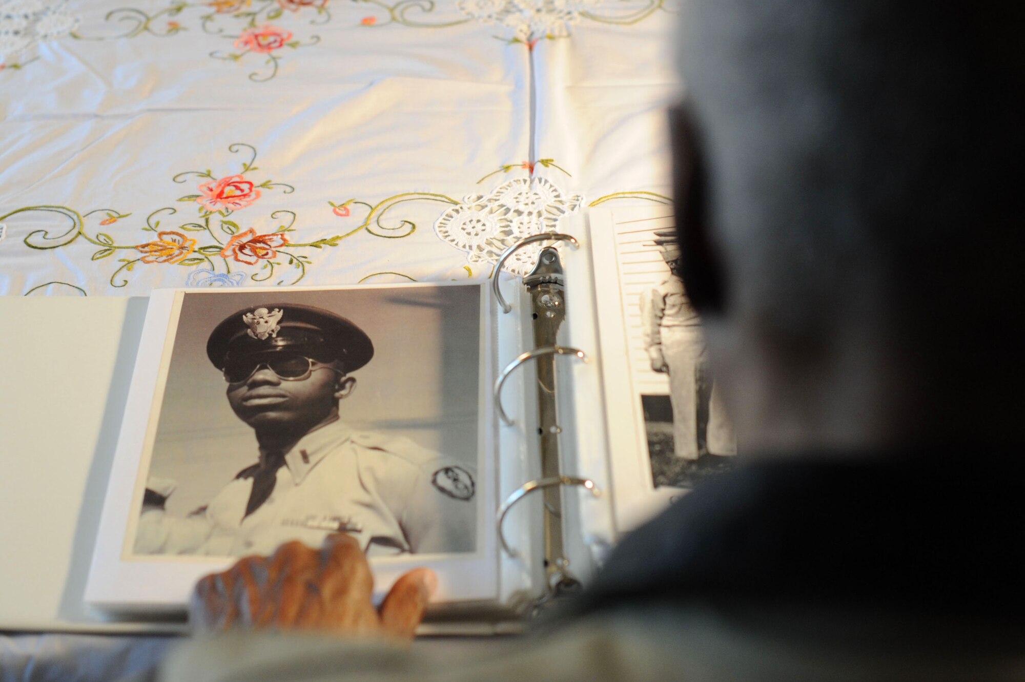 Retired Maj. George Boyd, looks at a photo of himself in service dress when he was younger, Feb. 25, 2016, at his home in Wichita, Kan. Boyd served for nearly three decades as both an enlisted Airman and a commissioned officer and is currently a colonel in the U.S. Civil Air Patrol. (U.S. Air Force photo/Airman 1st Class Christopher Thornbury)  