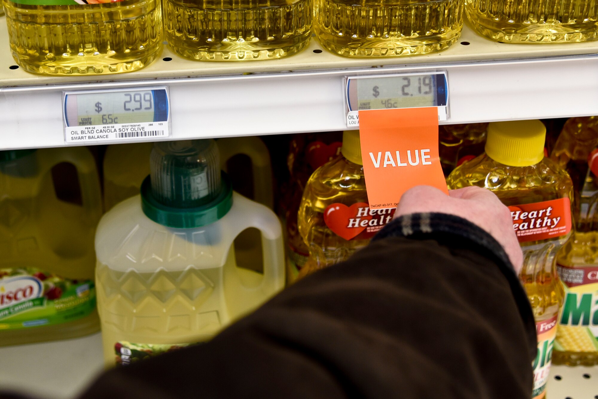 The Defense Commissary Agency program designed Commissary Value Brands; quality goods at low prices to provide savings on national name brand items comparable to low-cost store brand or private label items in commercial stores. Customers are able to identify value brands by looking for the orange value tags on nearly 500 products across 54 categories. (U.S. Air Force photo/ Senior Airman Janelle Patiño)