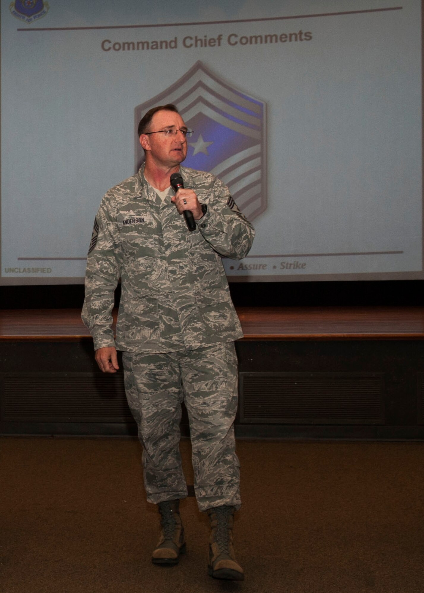 Chief Master Sgt. Marty Anderson, 8th Air Force command chief, speaks to Airmen of the 7th Bomb Wing during an all-call Feb. 17, 2016, at Dyess Air Force Base. Anderson used this time as an opportunity to speak to Airmen about the new Enlisted Performance Report and the importance of taking risks when stepping into a new role or responsibility. (U.S. Air Force photo by Airman First Class Katherine Miller/Released)
