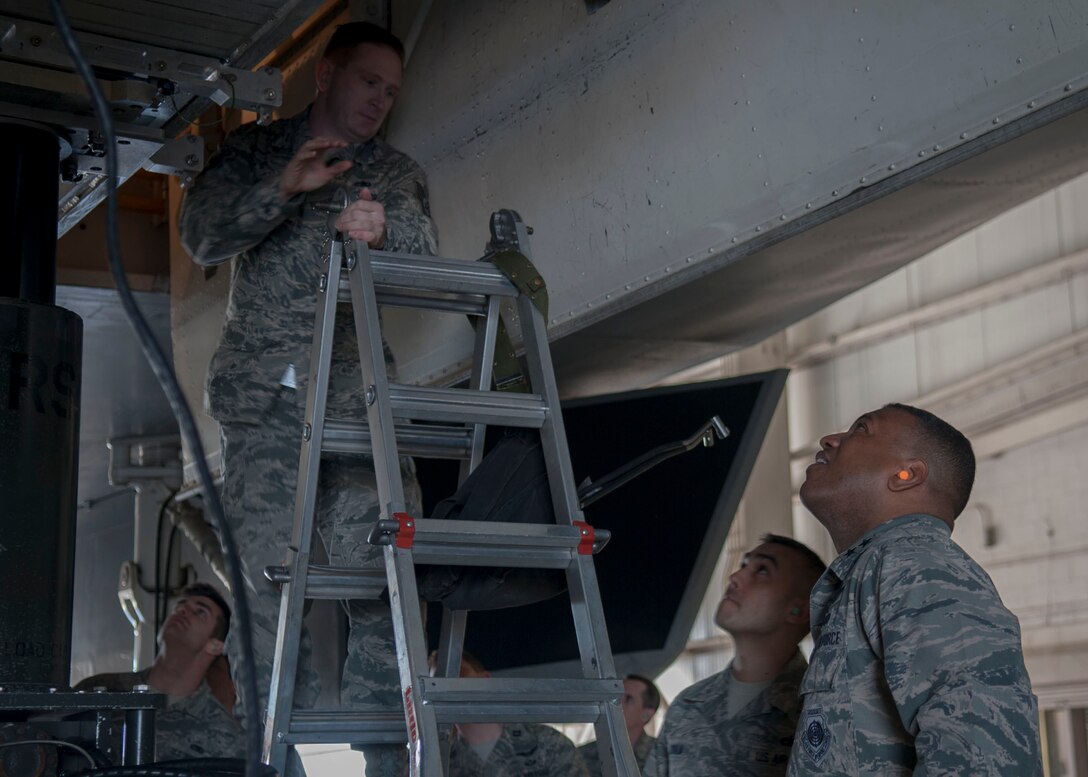 U.S. Air Force Maj. Gen. Richard M. Clark, 8th Air Force commander, observes a Joint Air-to-Surface Standoff Missile load at the Weapons Load Barn Feb. 16, 2016 at Dyess Air Force Base, Texas. Clark used his visit as an opportunity to see how Dyess Weapons Airmen provide combat-ready B-1 aircraft for combatant commanders. (U.S. Air Force photo by Airman First Class Katherine Miller/Released)