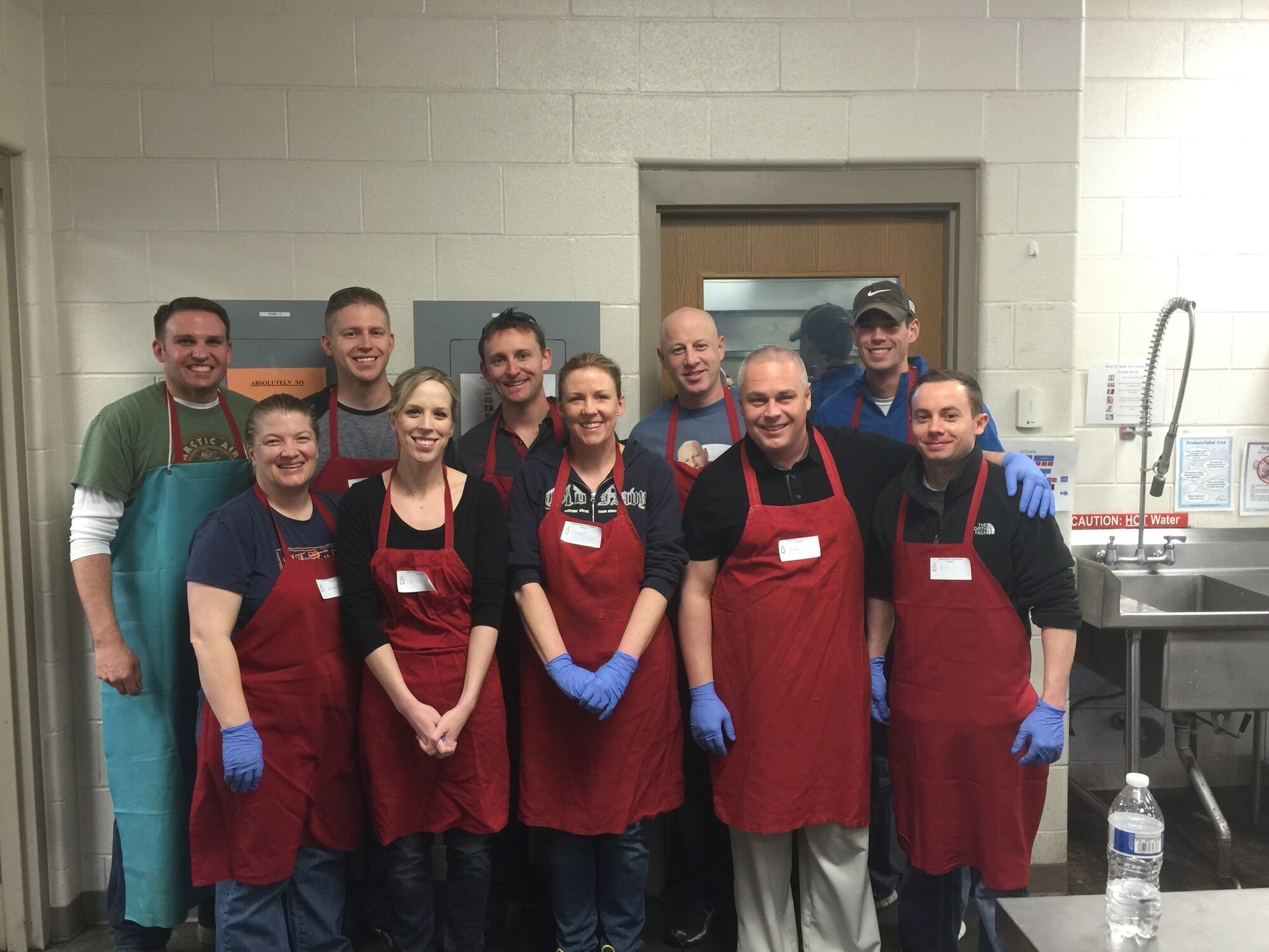 Airmen with 2nd and 19th Space Operations Squadrons volunteer Feb. 17, 2016, at the Marian House Soup Kitchen in Colorado Springs, Colorado. Twelve volunteers logged 46 hours at the organization to feed the homeless. (Courtesy photo)
