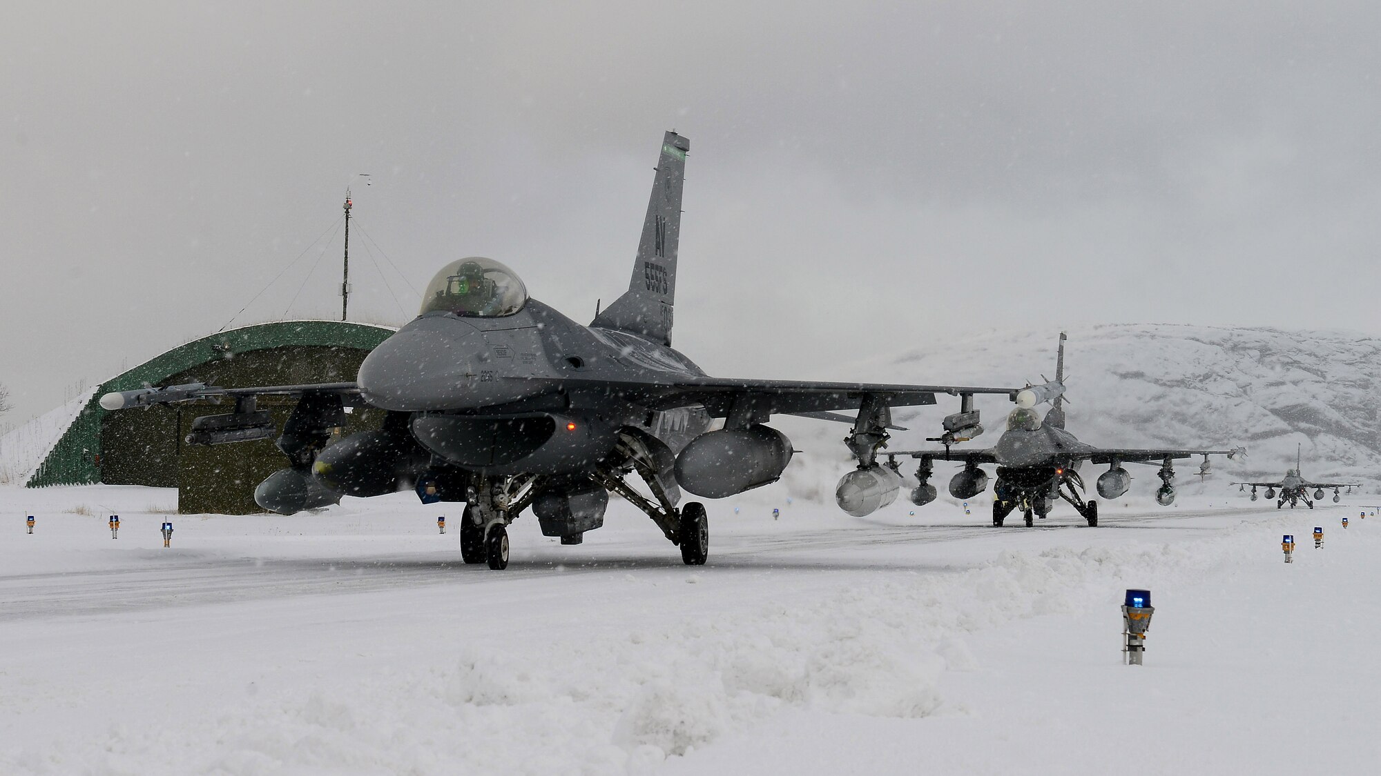 F-16 Fighting Falcons from Aviano Air Base, Italy, taxi to their hangars at Bodø Main Air Station, Norway, Feb. 27, 2016, before Exercise Cold Response 16. The exercise features maritime, land and air operations to underscore NATO’s ability to defend against any threat in any environment (U.S. Air Force photo by Staff. Sgt. R.J. Biermann/Released)