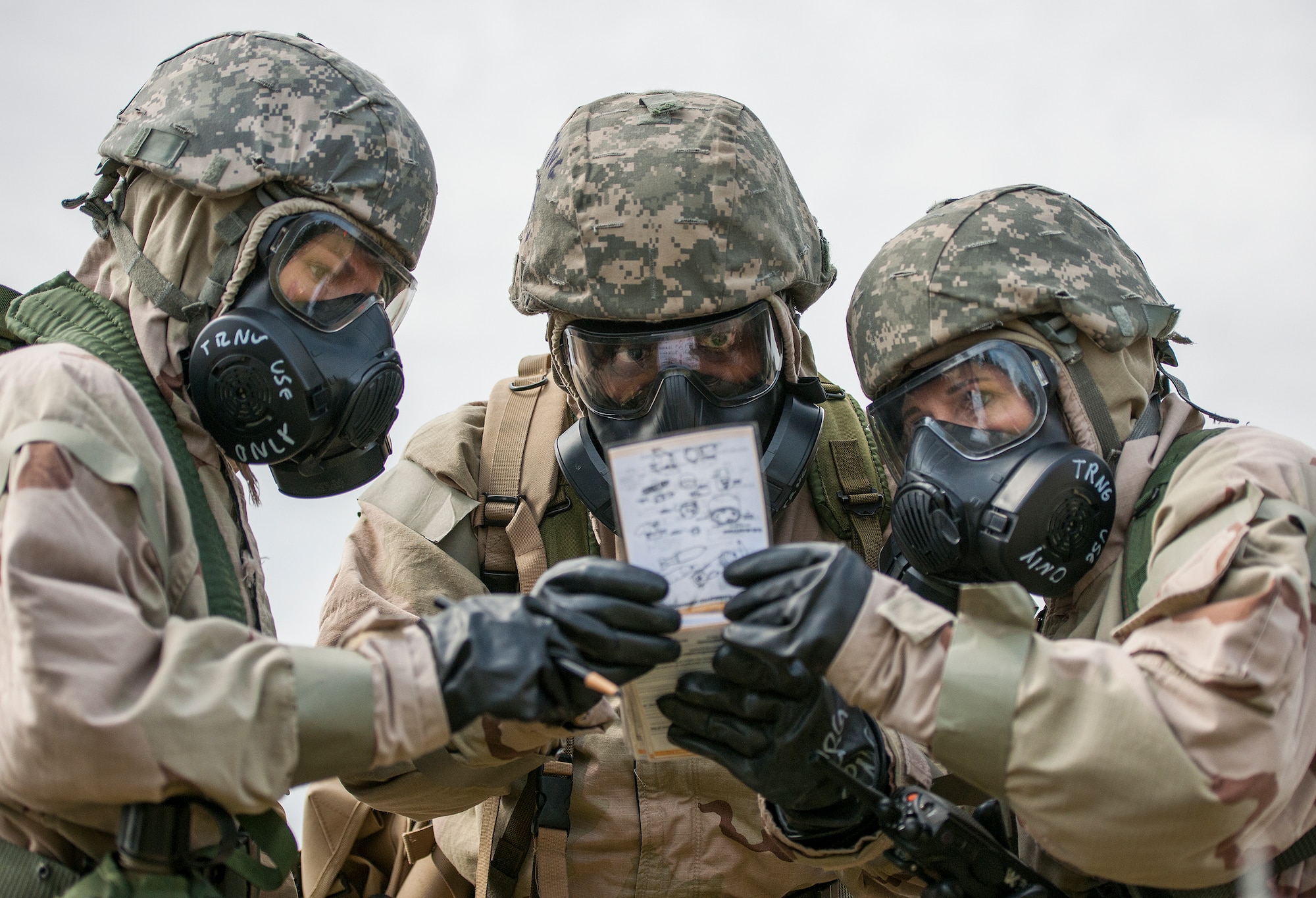 Airmen use their checklist to determine what type of ordnance they found during a chemical, biological, radiological, nuclear and explosive exercise at Eglin Air Force Base, Fla., Feb. 23.  The exercise evaluated the Airmen’s ability to meet wartime and contingency taskings of employing and sustaining the force and the ability to survive and operate.  (U.S. Air Force photo/Samuel King Jr.)