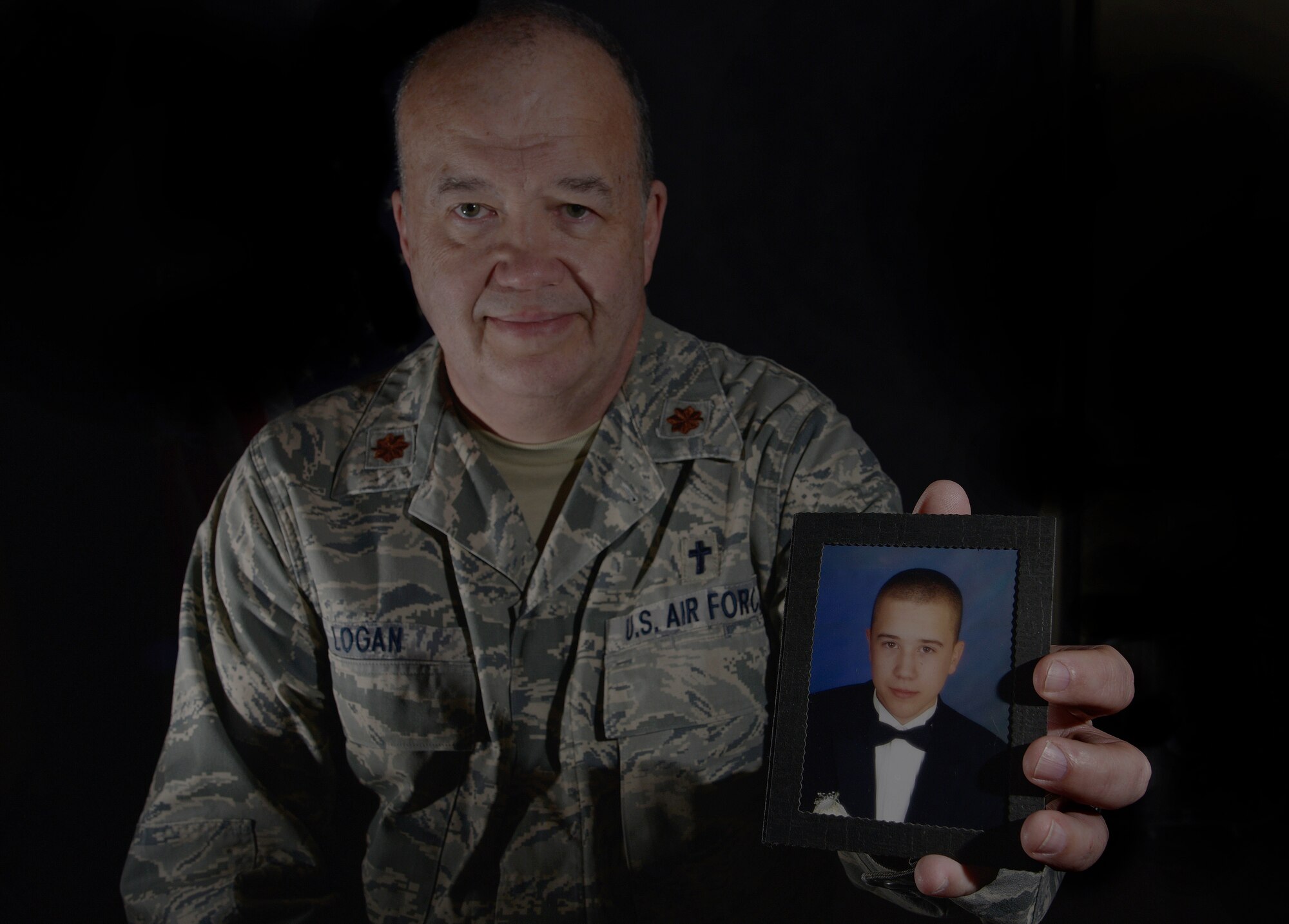 U.S. Air Force Maj. William Logan, a chaplain with the 35th Fighter Wing, holds a picture of his son, Zac, at Misawa Air Base, Japan, Feb. 23, 2016. Logan shared the story of his son’s suicide and the effects of the aftermath. He highlighted the recovery process hoping to inspire others to come forward for help in times of need. Logan is from Medina, Tennessee. (U.S. Air Force photo by Airman 1st Class Jordyn Fetter)