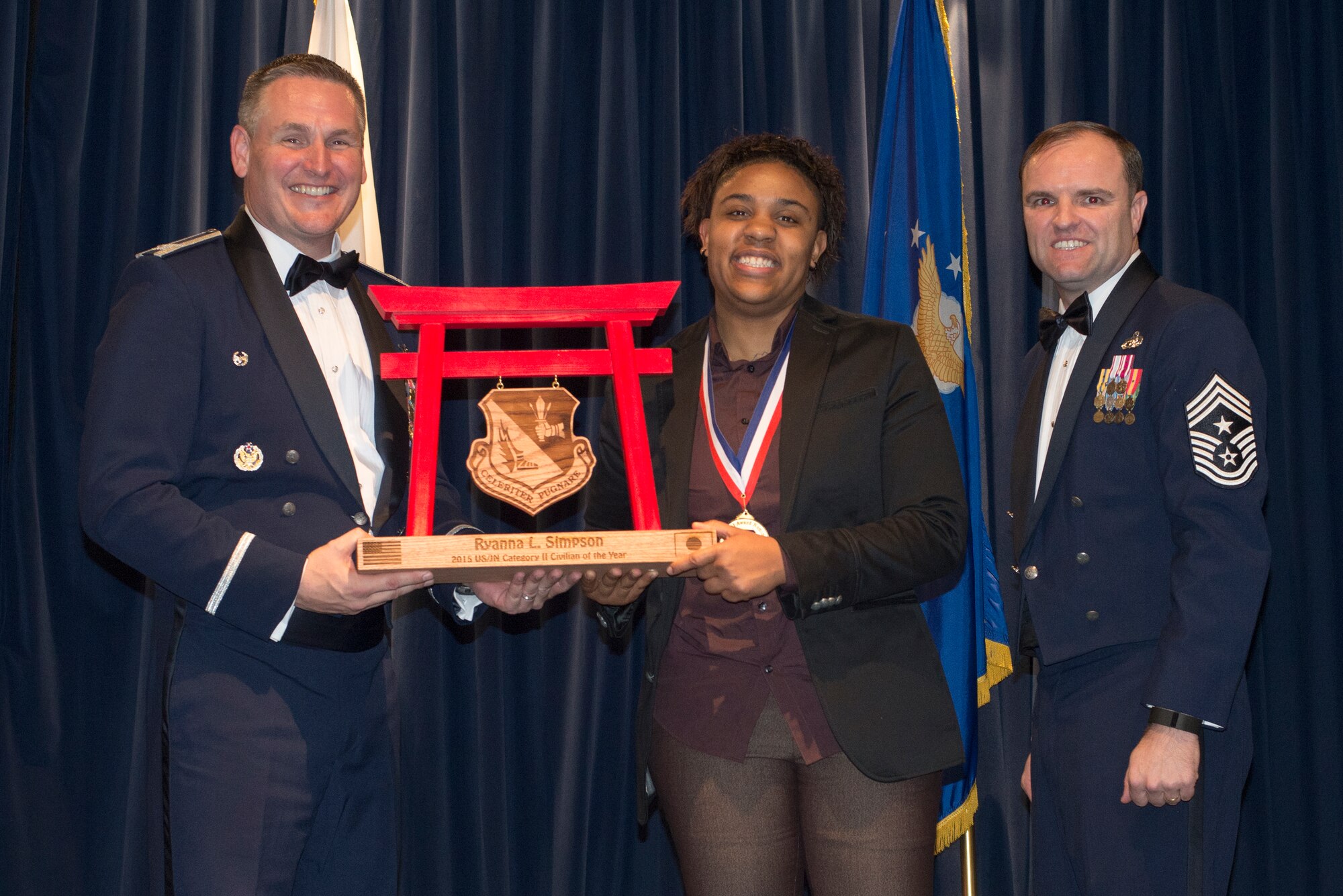 Ryanna Simpson, 374th Aerospace Medicine Squadron, receives the 2015 US/Japan Category II Civilian of the Year Award at Yokota Air Base, Japan, Feb. 19, 2016. (U.S. Air Force photo by Senior Airman David Danford/Released)