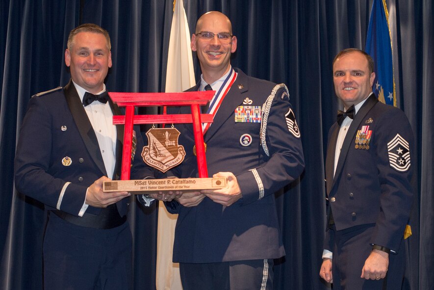 Master Sgt. Vincent Catalfamo, 374th Civil Engineer Squadron, receives the 2015 Honor Guardsman of the Year Award at Yokota Air Base, Japan, Feb. 19, 2016. (U.S. Air Force photo by Senior Airman David Danford/Released)		