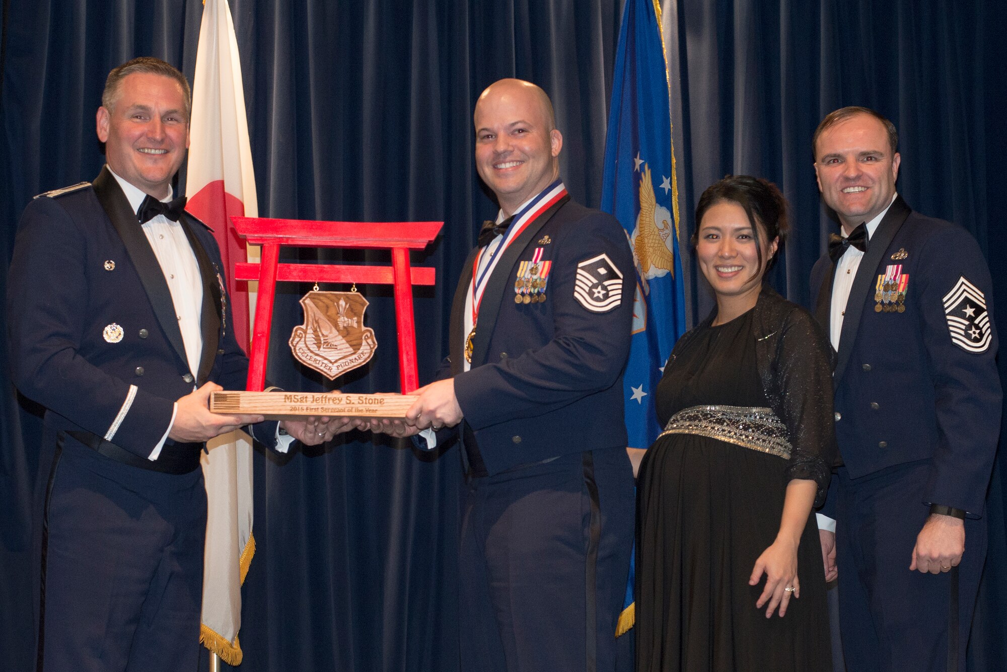 Master Sgt. Jeffrey Stone, 374th Operations Group, receives the 2015 First Sergeant of the Year Award at Yokota Air Base, Japan, Feb. 19, 2016. (U.S. Air Force photo by Senior Airman David Danford/Released)