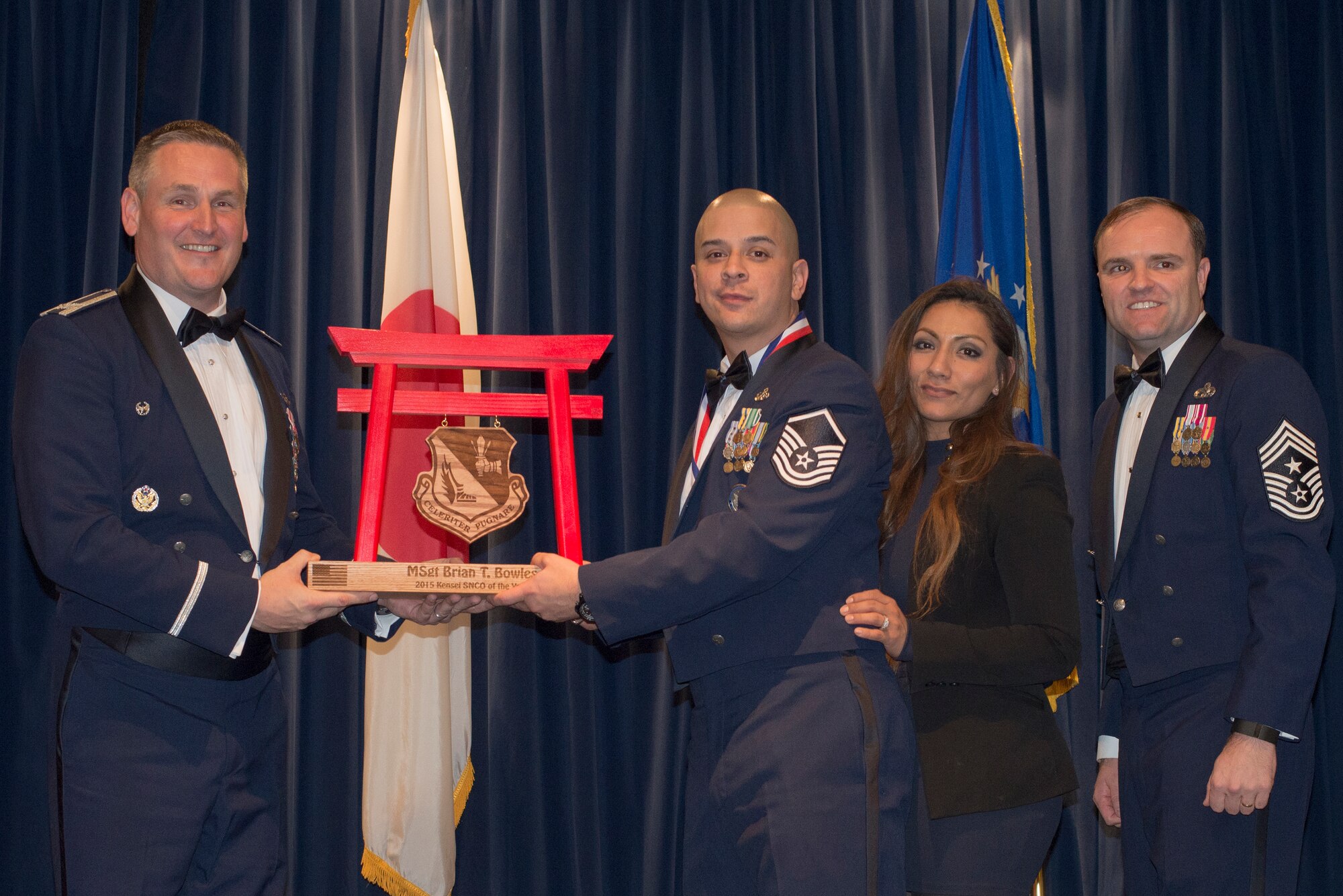Master Sgt. Brian Bowles, Defense Threat Reduction Agency, receives the 2015 Kensei Senior NCO of the Year Award at Yokota Air Base, Japan, Feb. 19, 2016. (U.S. Air Force photo by Senior Airman David Danford/Released)